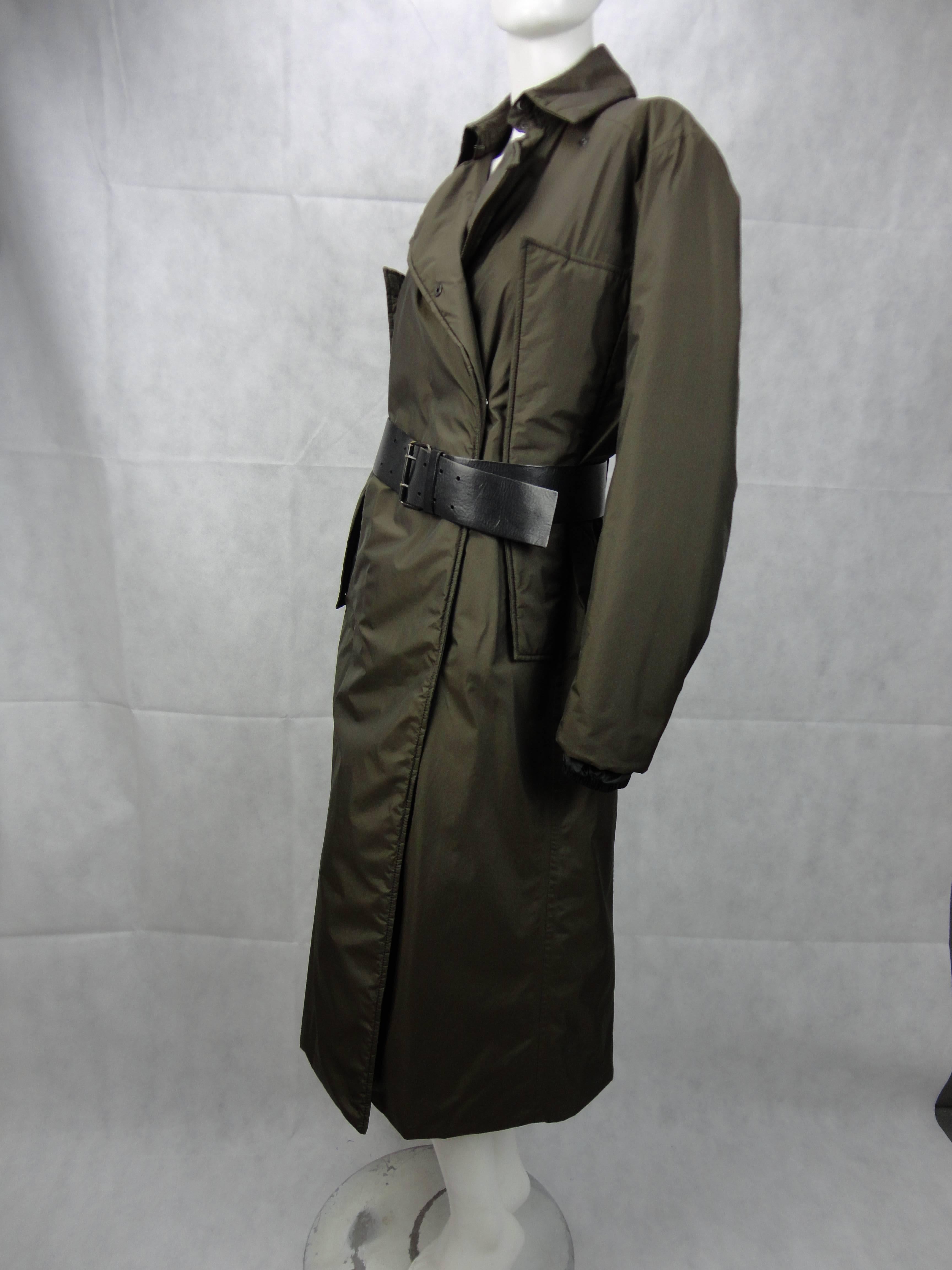 Prada dark green long coat with black leather belt. 
A lot of secret pockets so it is very practical. 
Very warm, perfect for winter. 
Lenght 120 cms 
Shoulder 42 cms 
Chest 52 cms 
Sleeve 61,5 cms

