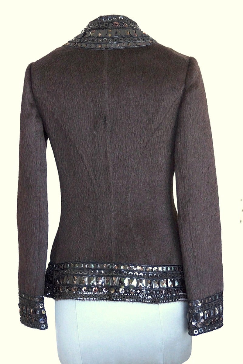 Guaranteed authentic OSCAR de la RENTA sensational adorned camel hair jacket. 
Long camel hair is rich chcolate brown with gorgeous shaping.
Exquisite adornment of pailletes and beading in a combination of unique shapes in black and brown.
Brown