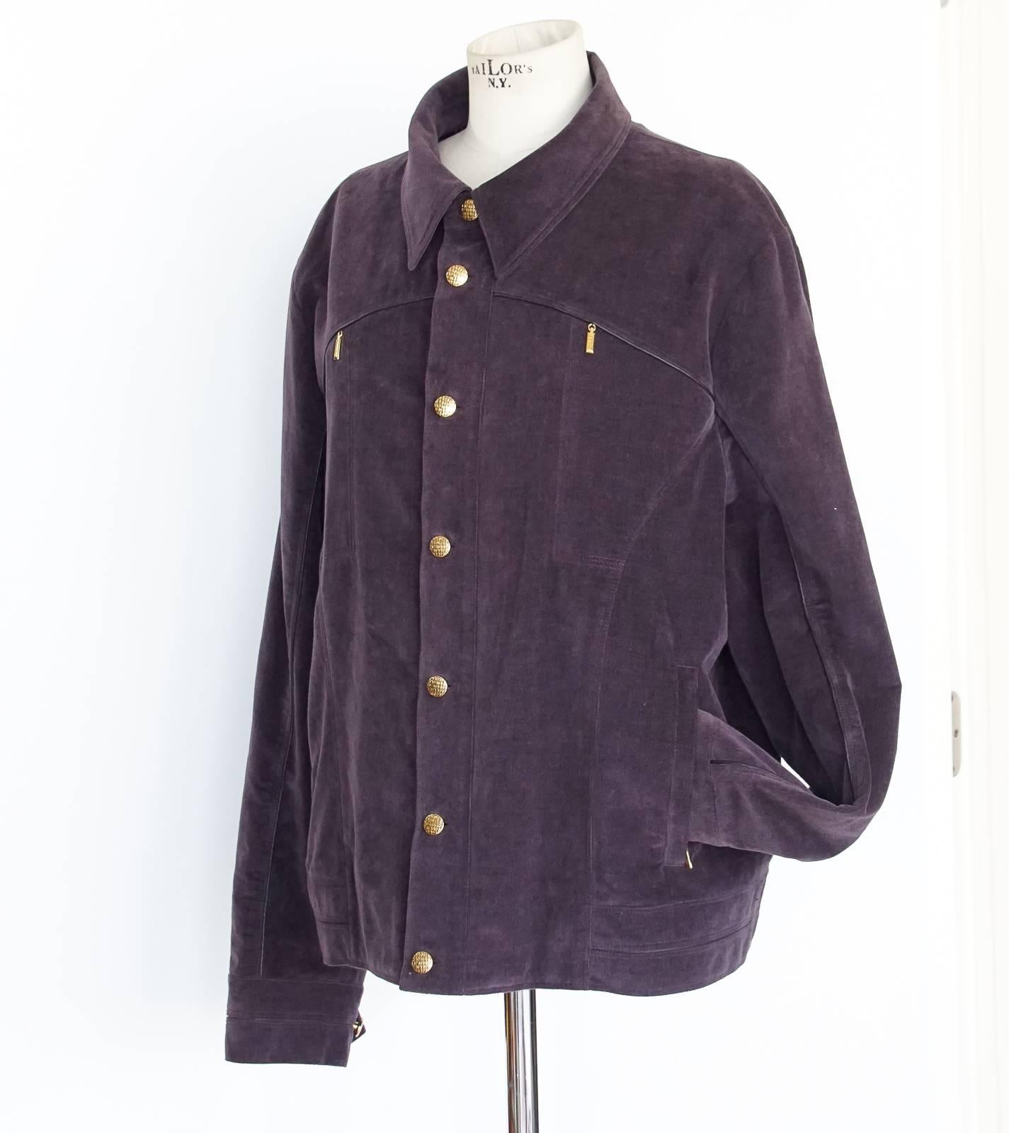 Guaranteed authentic Zilli amethyst corduroy jacket with leather piping.
7 gold front buttons and 2 buttons at each cuff - all embossed.
2 slash zip pockets with logo embossed pulls.
2 sewn in ornamental embossed pulls.
2 internal pockets with