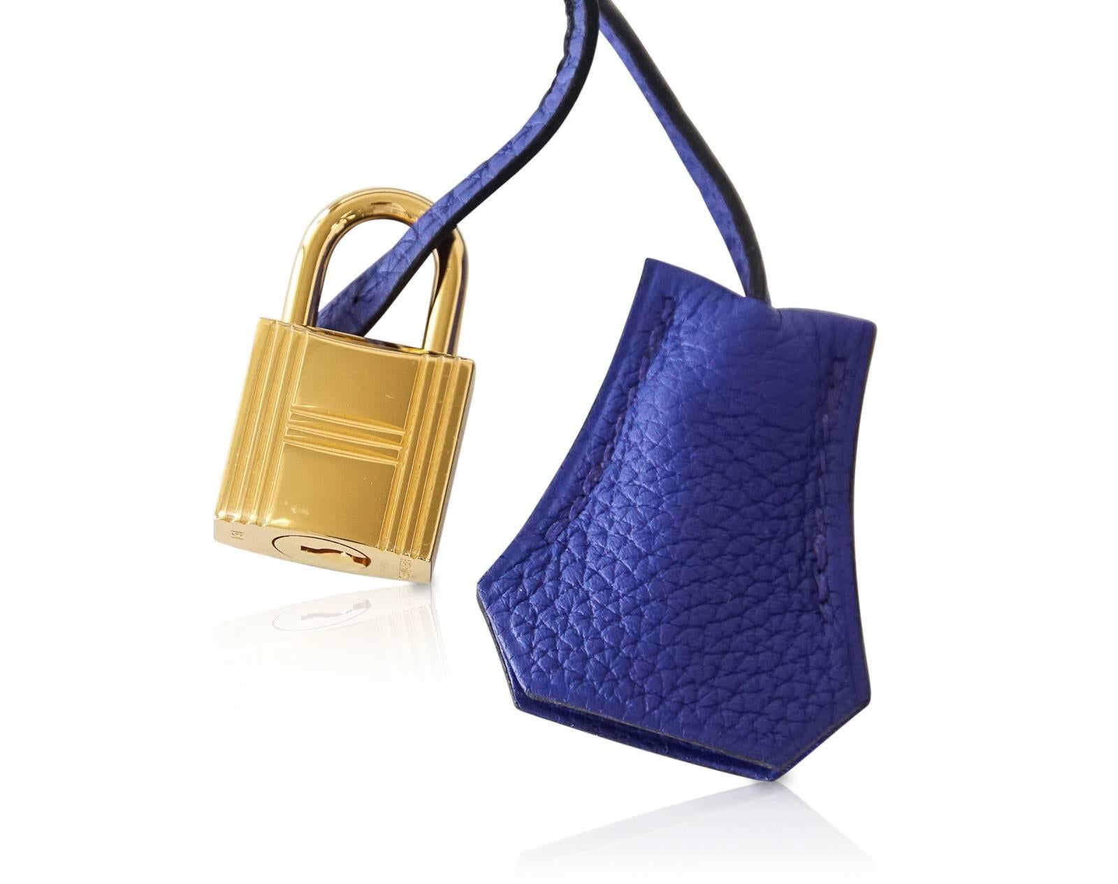 Jewel toned Hermes 35 Kelly Retourne in brilliant Electric Blue.  
Lush with Gold hardware.  
Togo leather. 
Comes with lock, keys, clochette, sleepers, raincoat, Signature Hermes box.
NEW or NEVER WORN
final sale

BAG MEASURES:
BASE LENGTH 35cm /
