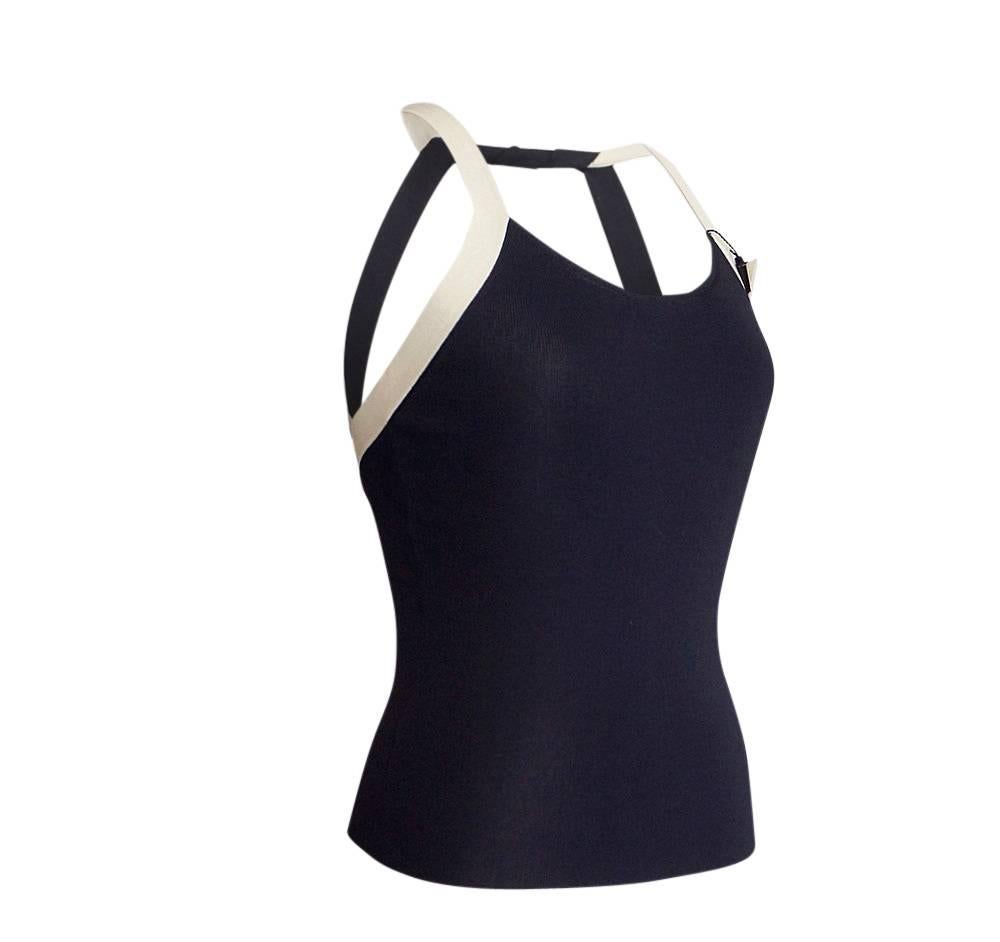 Guaranteed authentic Giorgio Armani navy and bone modified halter top.   
Beautifully designed and cut knit modified halter top. 
A fabulously chic combination in deep navy with bone trim.
Rear detail with open back creates a perfect top for the
