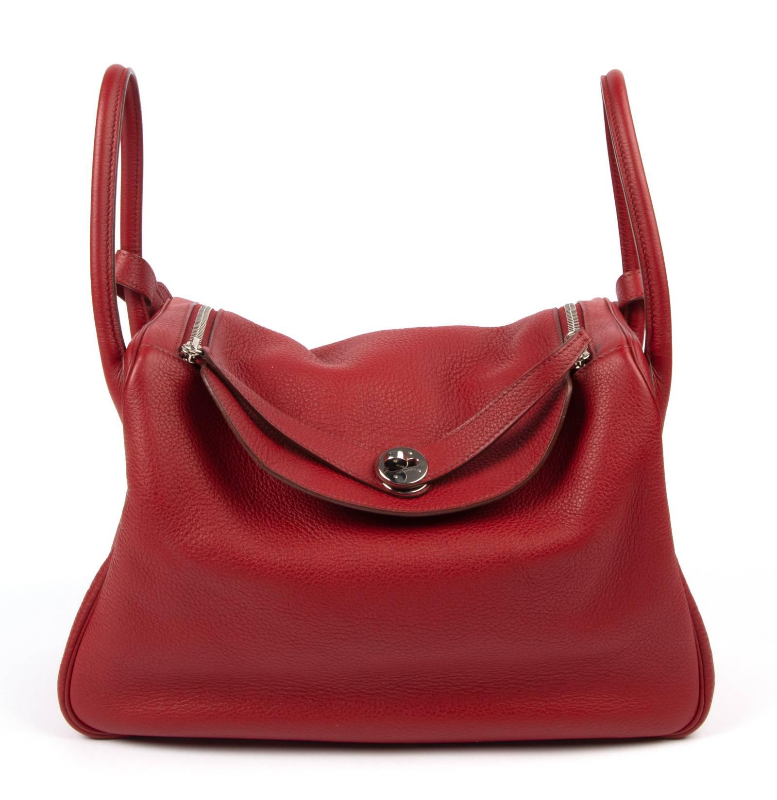 Beautiful rich Rouge Hermes Lindy 34 Bag.
Carry by hand, or shoulder, and the bag changes it whole look in one move! 
Spacious interior with a interior pocket on each side. 
Top has two zippers for easy closure - and you can easily wear the zippers