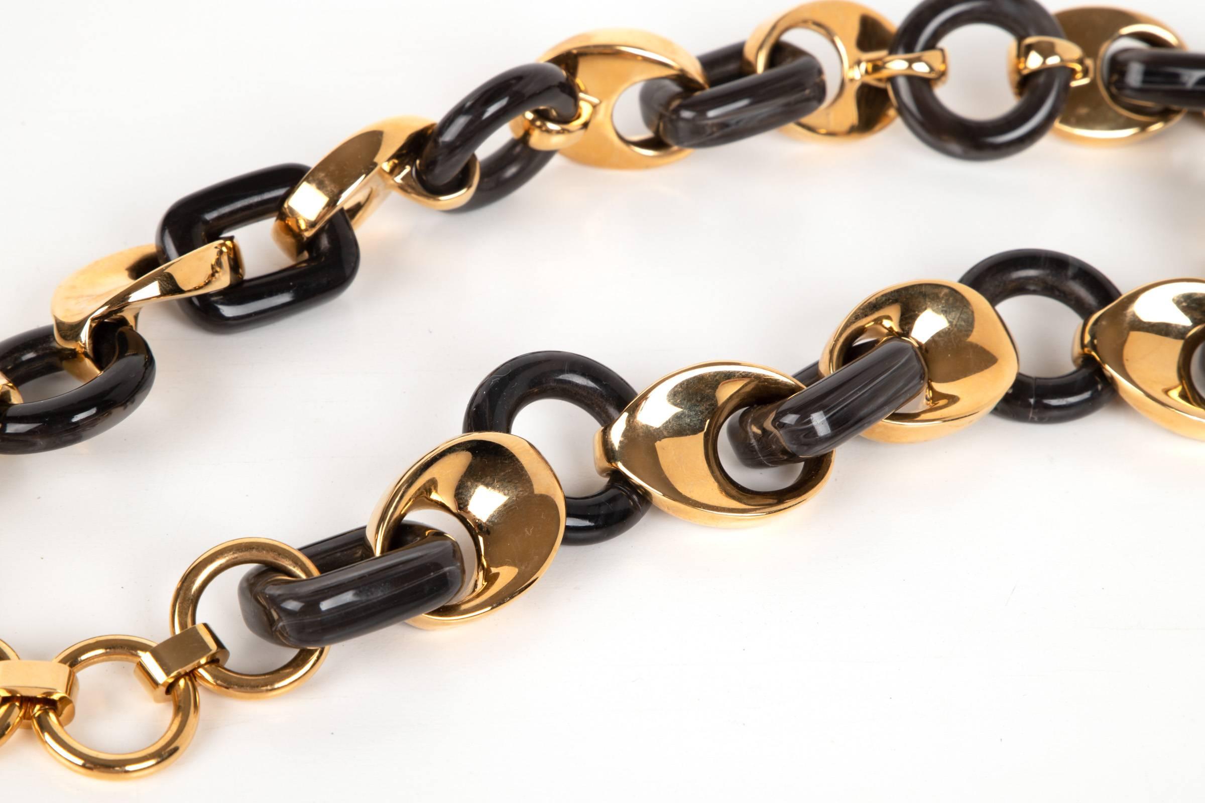 Guaranteed authentic Chloe link necklace.
Alternating links of gold and black lacquered acrylic.
Logo embossed metal link at closure.
Necklace can extend an additional 3