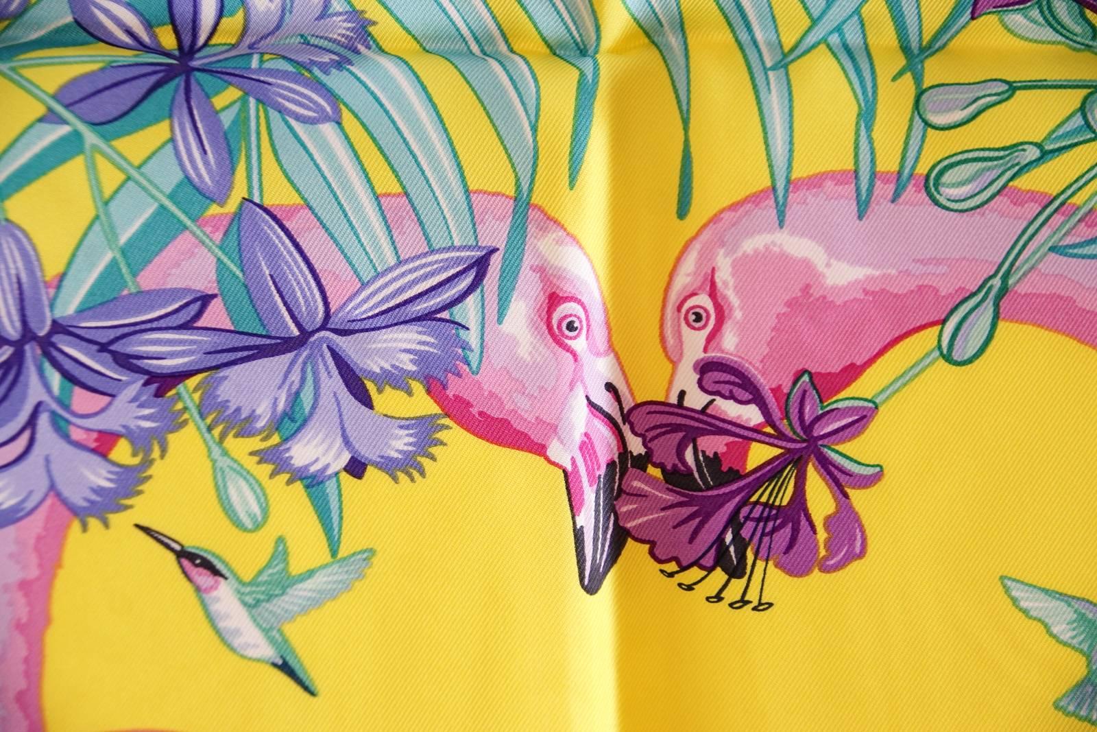 Guaranteed authentic limited edition Hermes Flamingo Party silk scarf created for the opening of the Miami Hermes store. 
Exotic lush plants and flowers with Flamingos and hummingbirds.
Rich blues, pinks, purples and yellow.
HERMES - MIAMI printed
