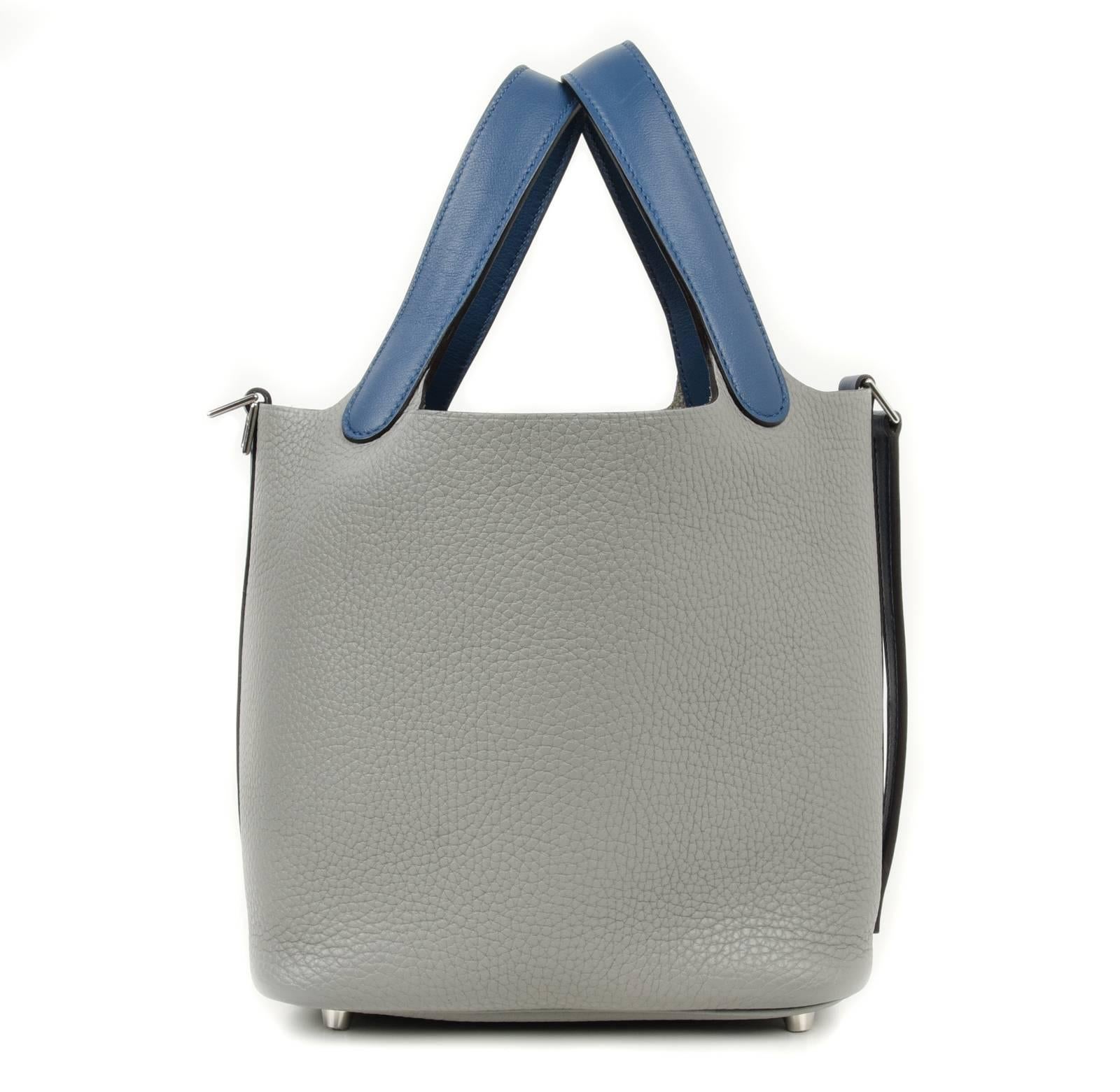 Guaranteed authentic Hermes Picotin Lock Touch 18cm limited edition Bi-color bag in Gris Mouette and Blue Agate.
An elegant combination for the perfect summer tote in clemence with swift handles.
Fresh with palladium hardware.
Comes with lock and