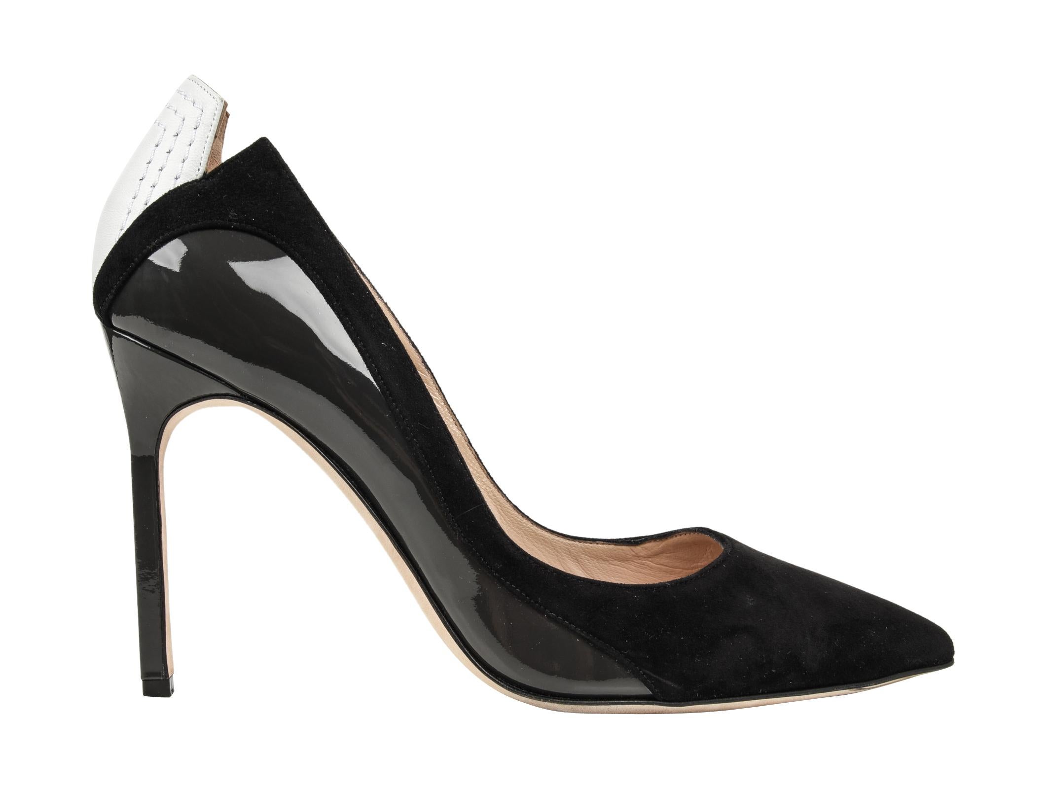 Guaranteed authentic Manolo Blahnik pump in black suede, charcoal patent leather and white leather.
Top of shoe is black suede, the sides are charcoal patent leather and black suede and the rear is white leather with tonal topstitch. 
Notched detail