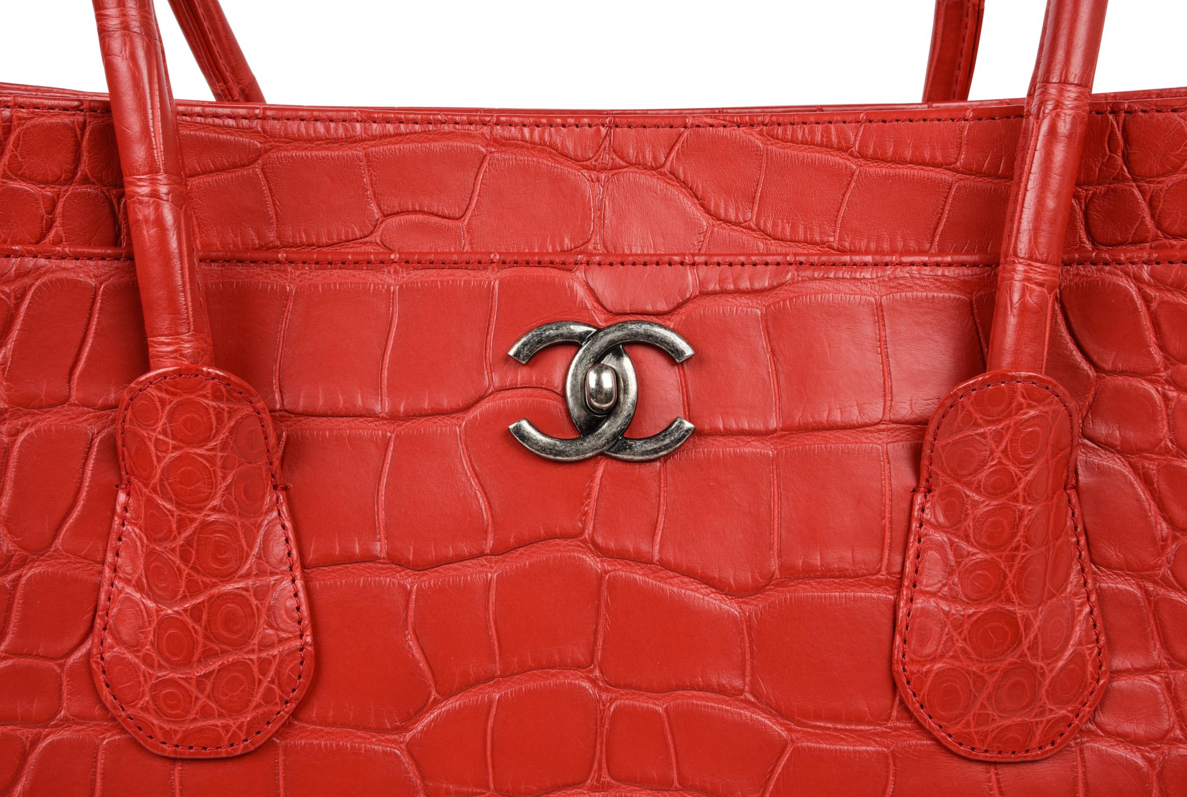 Guaranteed authentic Chanel rare matte alligator red rose Cerf tote bag.
A collectors find as Chanel no longer produces alligator bags!
Classic with front slot pocket with signature CC turnkey for closure.
Center hidden wide tab with magnetic