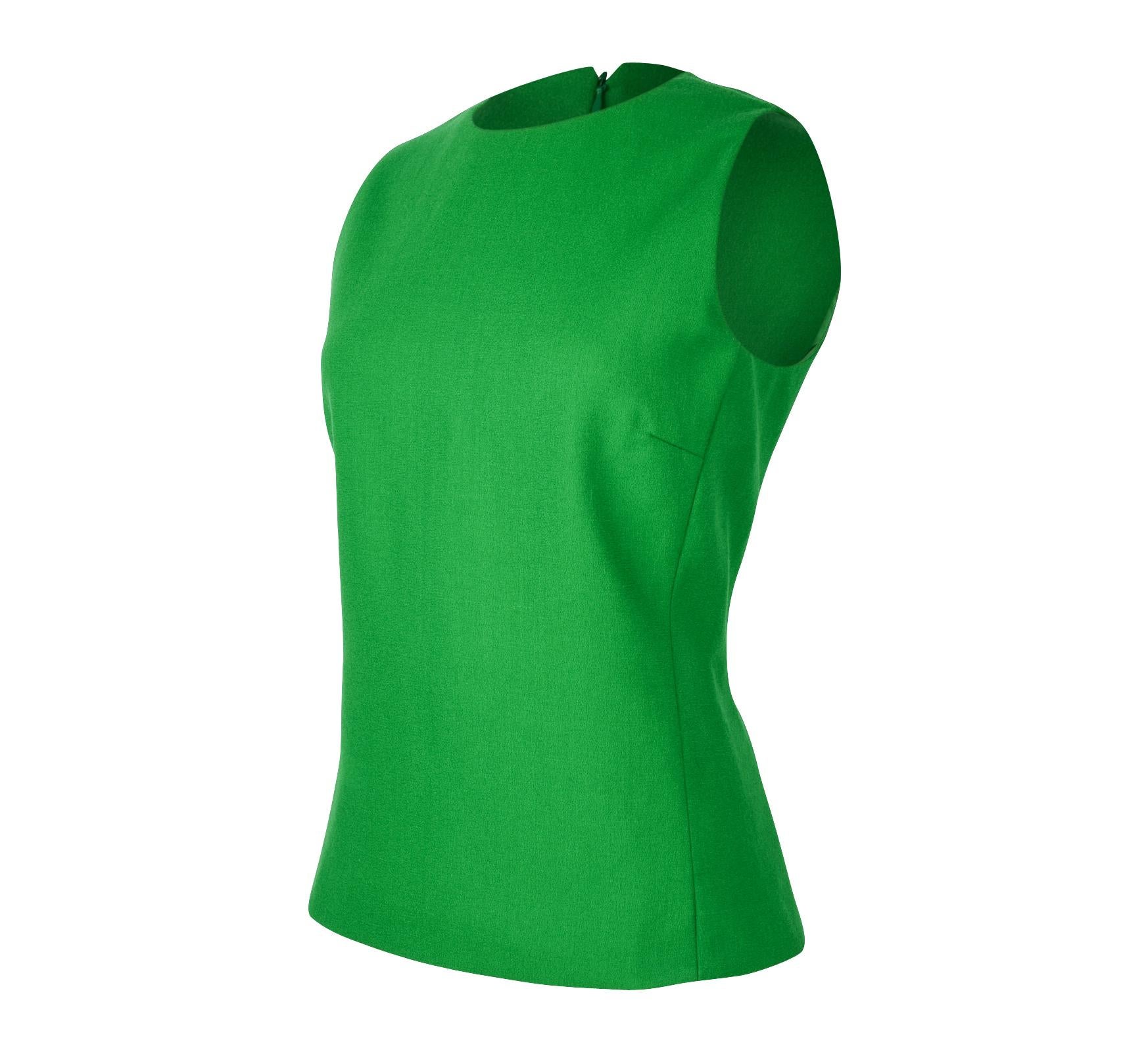 Guaranteed authentic Christian Dior emerald green sleeveless top. 
Shaped in a tunic style with jewel neckline and hidden rear zip.
No fabric or size tag.
final sale

SIZE fits 8

TOP MEASURES: 
LENGTH  24.5