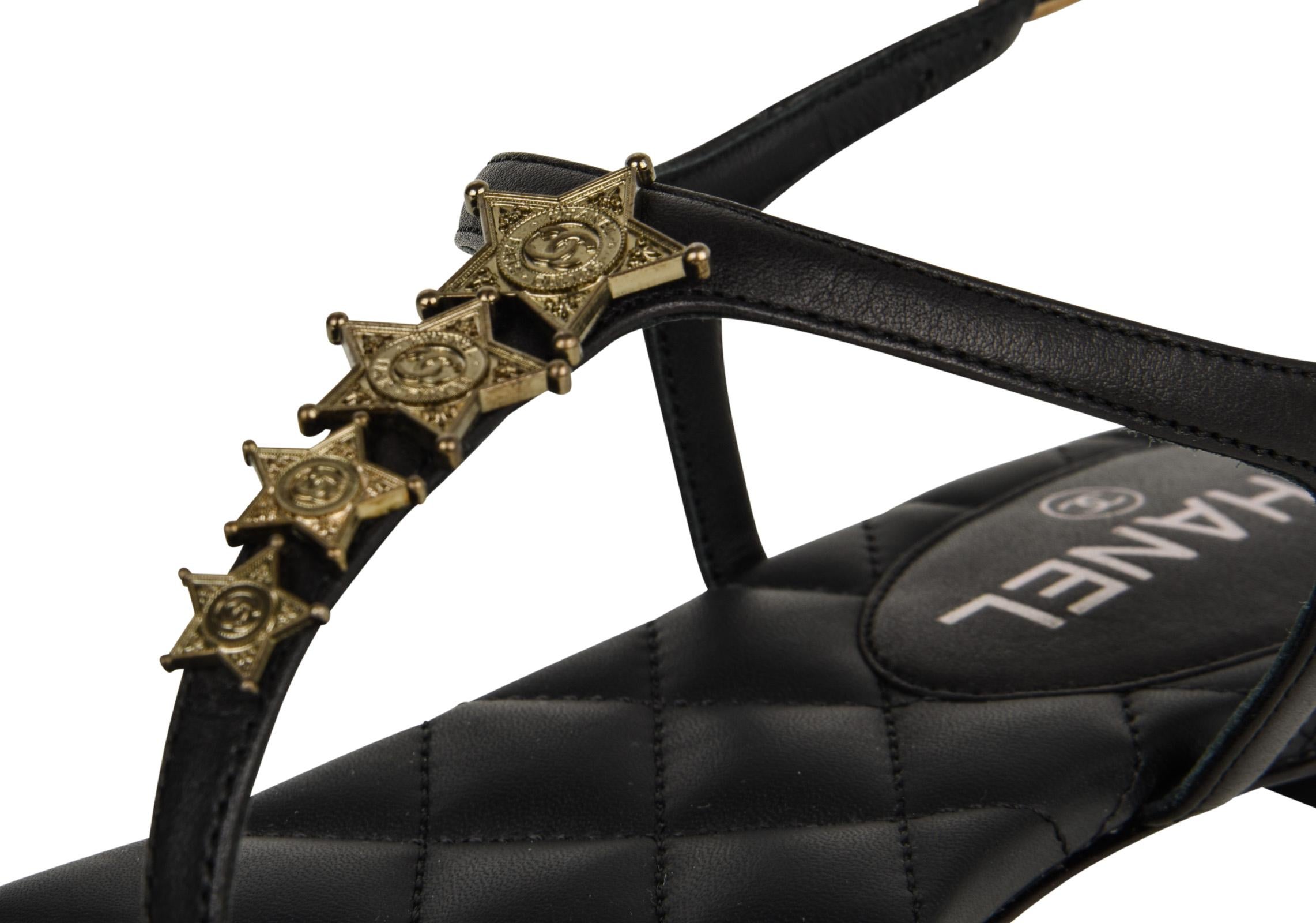 Guaranteed  authentic Chanel CC Star black leather T-strap thong flat sandal. 
Perfect summer sandal with 4 logo embossed stars across the T-strap.
Black signature quilted insole.
Embossed side buckle.
Comes with box and sleeper.
NEW or NEVER WORN

