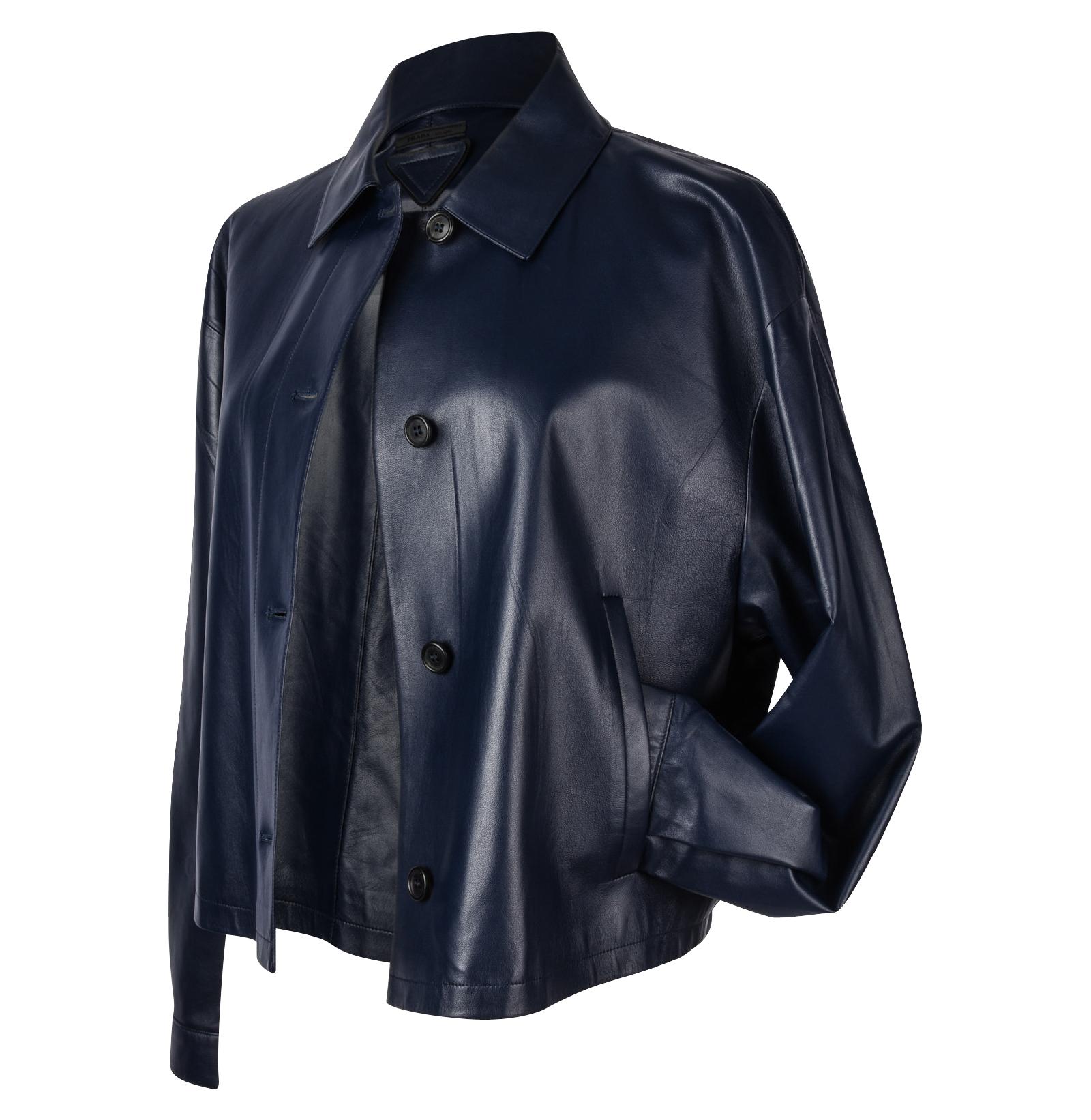 Guaranteed authentic Prada royal navy blue lambskin feather light jacket.  
Easy fit drop shoulder 4 button single breast.
Classic collar.
Cuffs with a button. 
2 faux slot pockets.
Rear has Prada triangle leather plaque and black Prada textile