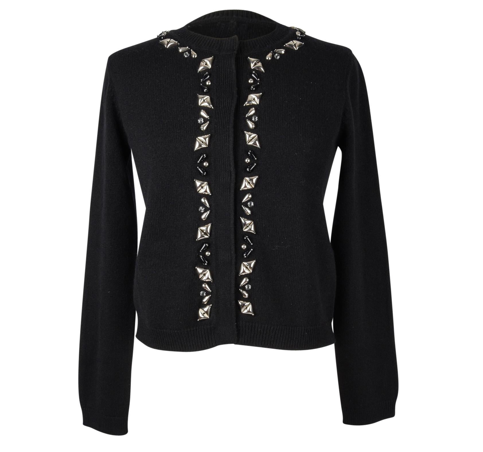 Guaranteed authentic Louis Vuitton black cashmere embellished cardigan. 
Front has black and silver embellishment along neckline and placket. 
5 snap button in hidden placket.
Fabric is 100% cashmere.

SIZE  S

CARDIGAN MEASURES
LENGTH  20
