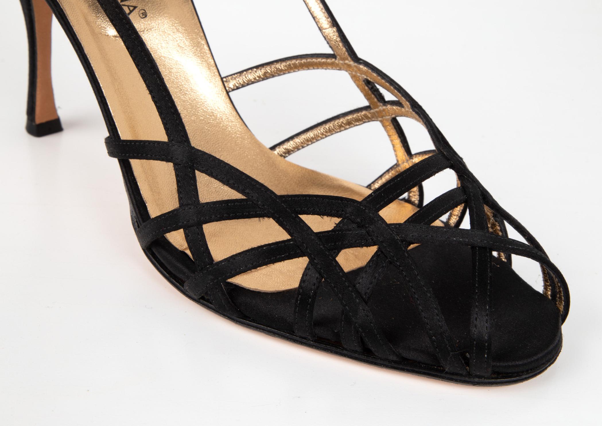 Guaranteed authentic Dolce&Gabbana jet black pretty satin shoe.   
Black satin strappy slingback shoe.
Thin straps create a woven design across the toe.
Shaped heel.  
final sale

SIZE 39.5
USA SIZE 9.5

SHOE MEASURES:
HEEL 4