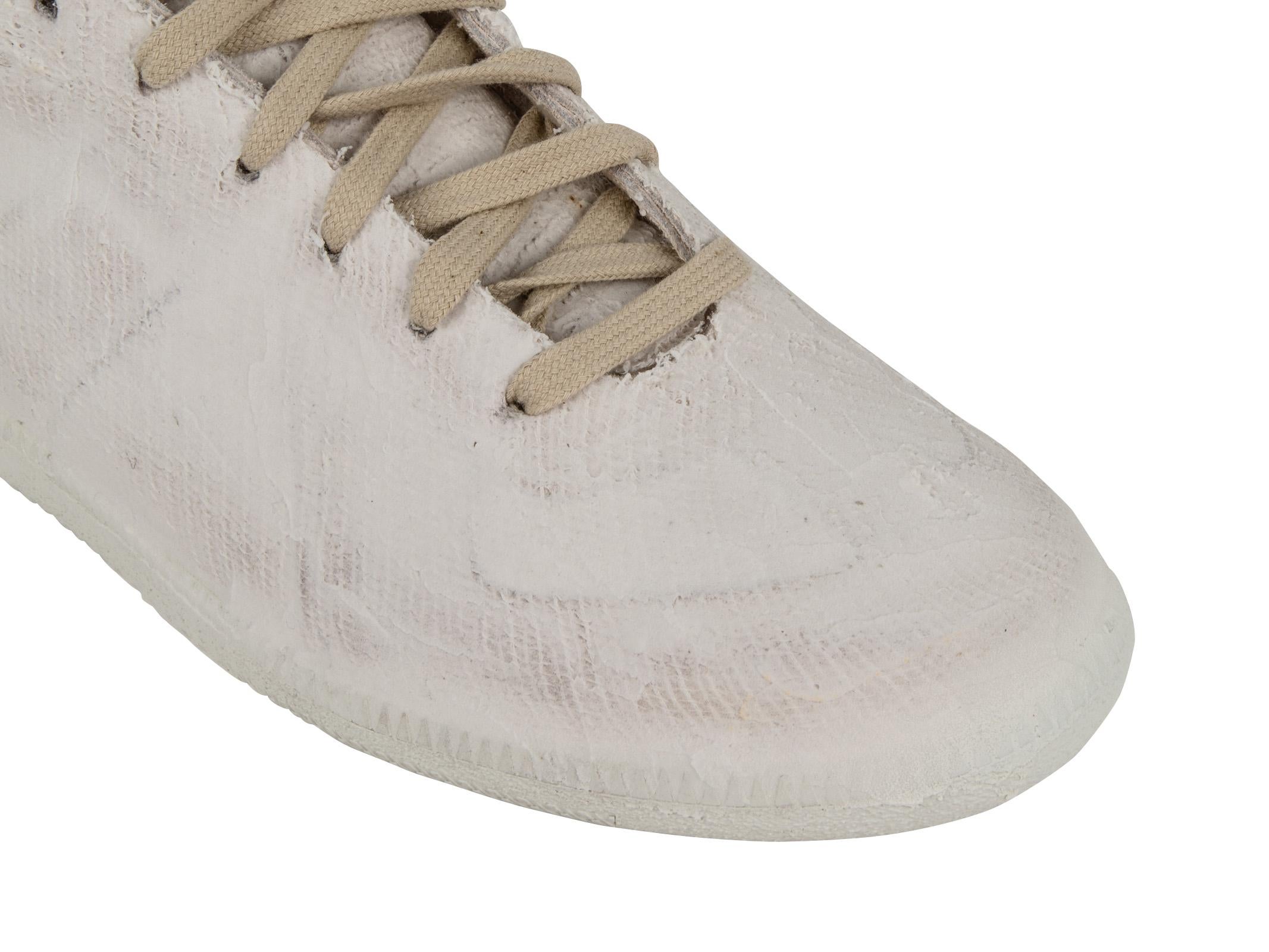 Maison Margiela men's white paint-finish sneaker. 
Rare to find this fabulous Maison Margiela sneaker is perfect for the summer season for a fresh look. 
Fabric is Lambskin and calf split.
NEW or NEVER WORN
final sale

SIZE  43
