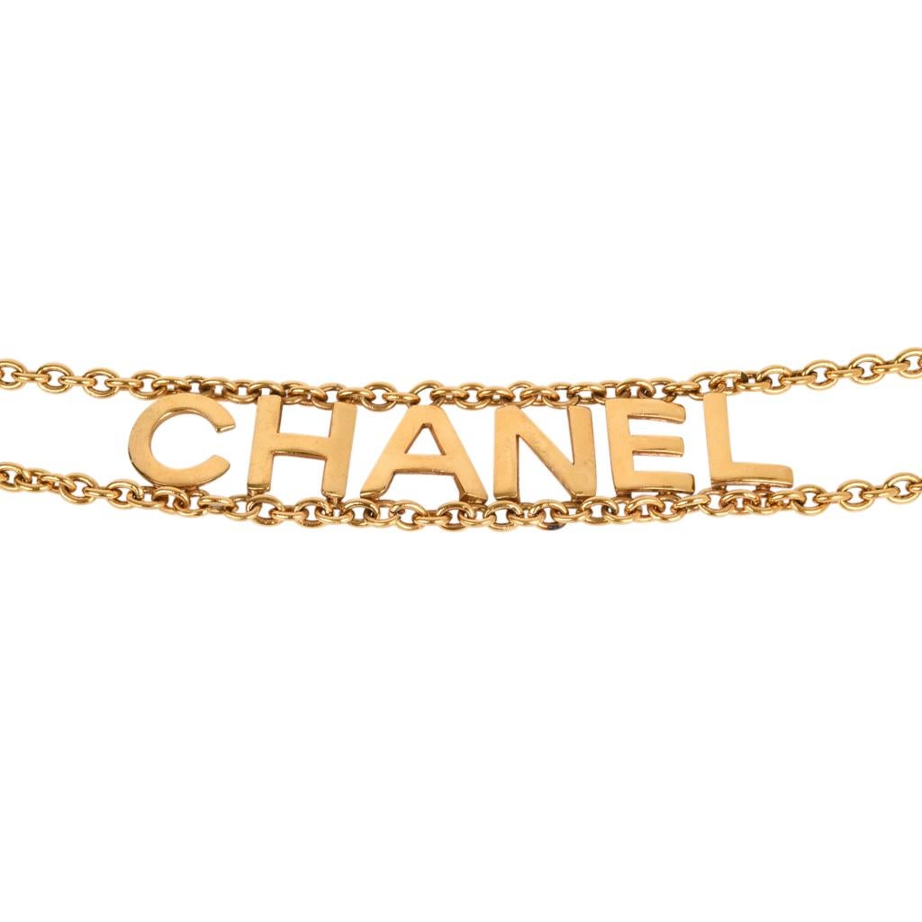 Vintage double chain belt with CHANEL spelled out. 
Each link allows belt to be adjusted.   
CC logo charm on belt chain. 
Metal logo plaque Chanel Made in France 
final sale

BELT MEASUREMENT:
LENGTH  36