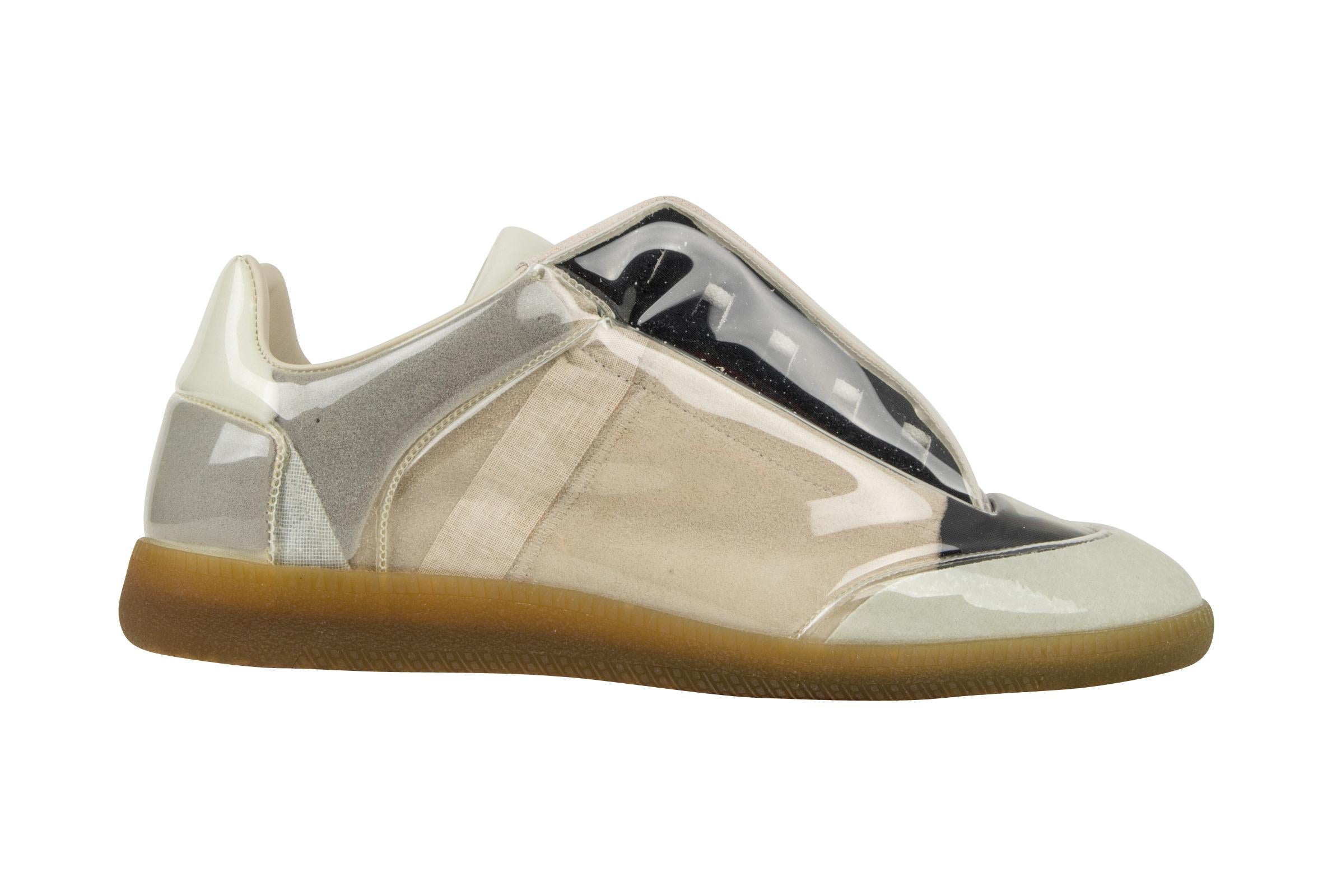 Guaranteed authentic Maison Martin Margiela men's sneaker.
Rare to find this fabulous Maison Martin Margiela sneaker is perfect for year round wear!
Gray, beige and navy suede and leather with PVC cover.
New or Never Worn.   
final sale

SIZE  43