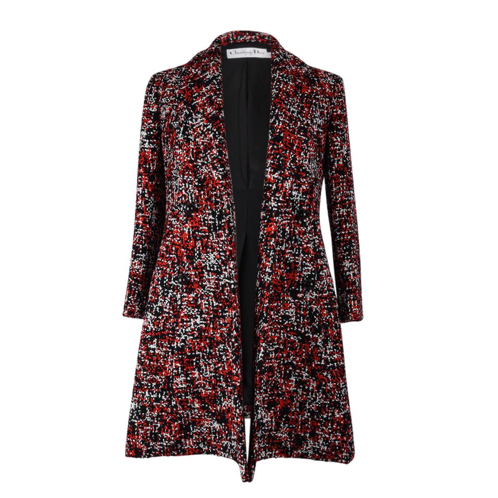 Guaranteed authentic Christian Dior exquisite double breast red, white and black tweed coat.
6 round embossed buttons.
Side pockets and side vents.
No size or fabric tag. Fabric feels like wool or wool blend.
final sale

SIZE:  
fits 6 

JACKET