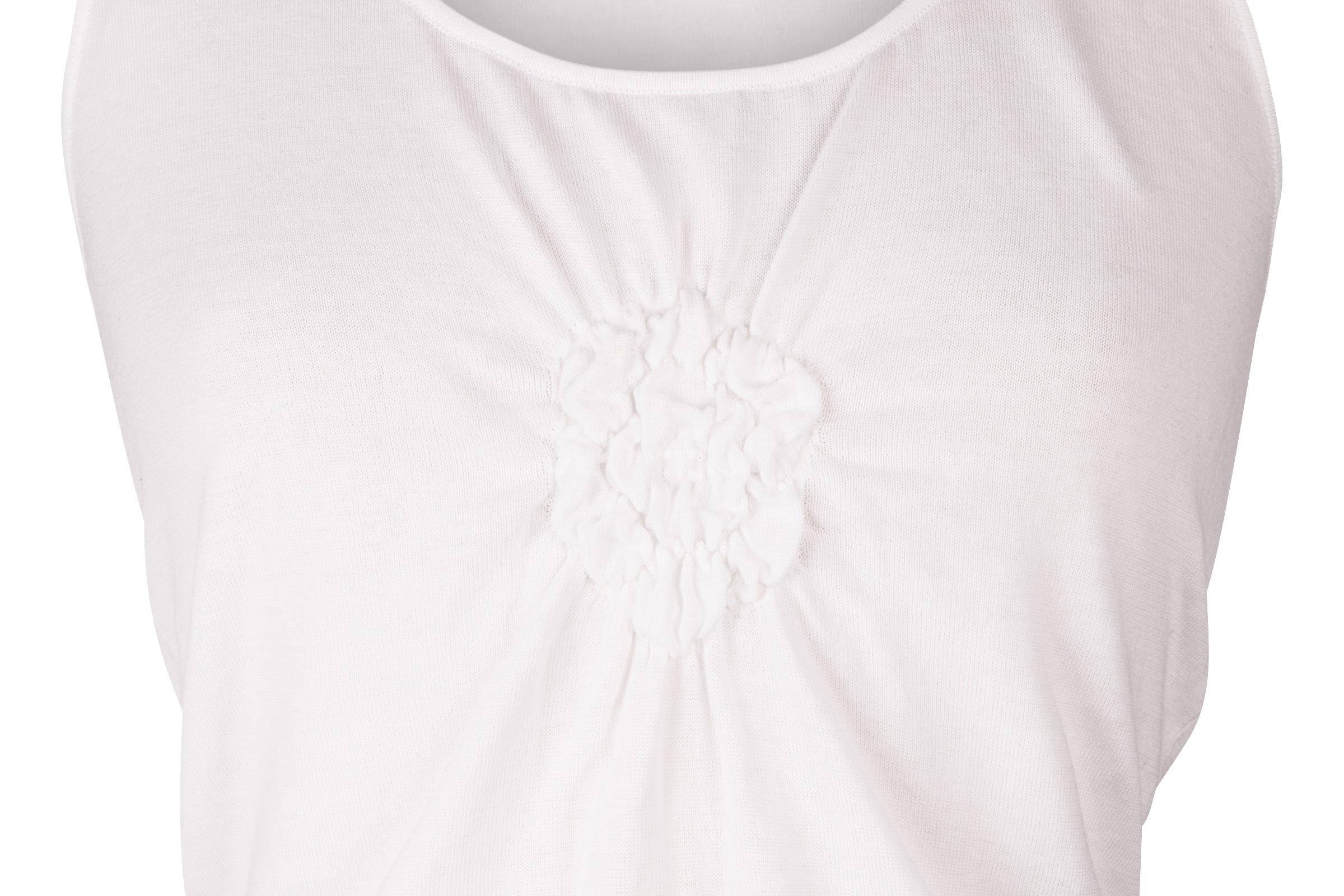 Guaranteed authentic Chanel 03C white camellia shell.  
Charming scoop neck with rouched camellia at center.
White knit sleeveless shell.
Ribbed bottom.
Very light weight.
Fabric is cotton and elastane.
final sale

SIZE 42 
USA SIZE 8 

TOP