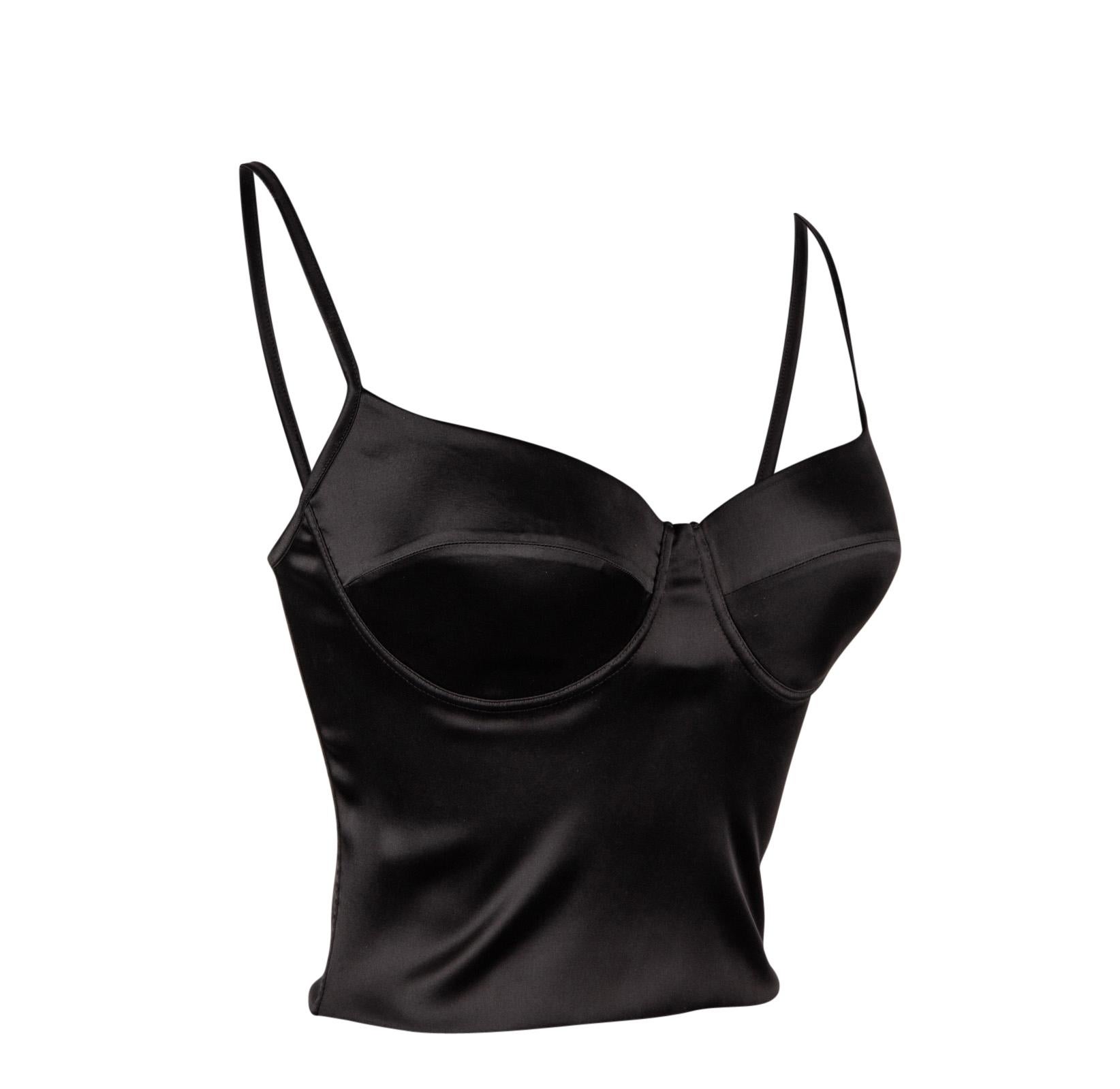 Guaranteed authentic Ritmo di La Perla solid black bustier.        
Defined cups with spaghetti straps.      
Flexible side boning provide support and form.
Back zip.    
Fabric is acetate, nylon and elastane.
Can be worn on its own or under a