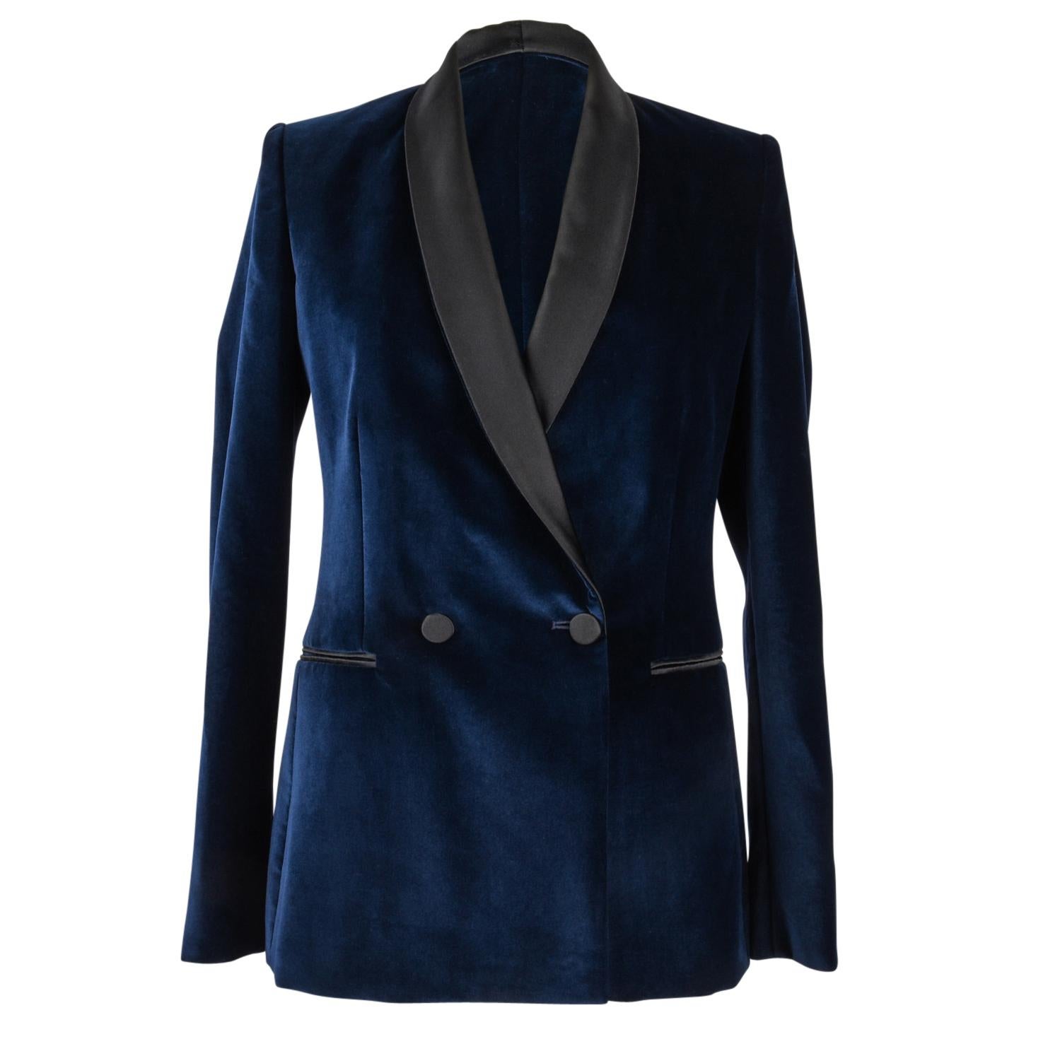 Guaranteed authentic Stella McCartney navy blue velvet tuxedo pant suit. 
Double breast jacket with black contrasting lapels, covered buttons and slot pockets.
Jacket has 4 covered working buttons on cuff. 
Rear vent. 
Jacket is in excellent