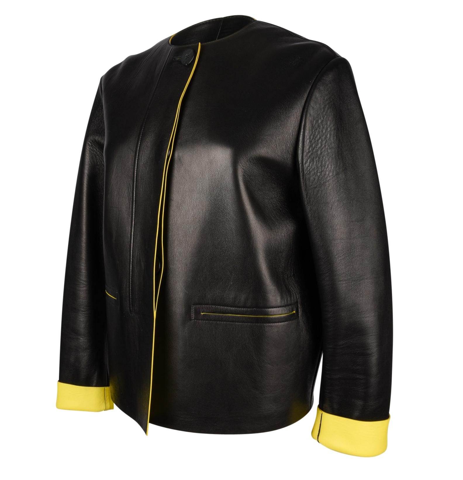 Guaranteed authentic Celine 3 button single breast plush leather jacket.  
Black with bold yellow interior and fine piping at slot pockets.
Wear cuffs folded to reveal yellow. 
Beautifully detailed placket for hidden buttons.
Exquisite!
Warm for
