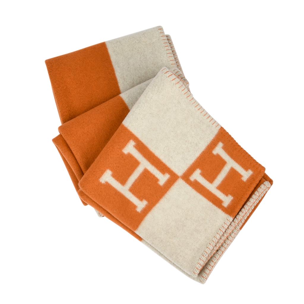 Guaranteed authentic Hermes classic Avalon I signature H blanket in Orange.
Created from 90% Merino Wool and 10% cashmere and has whip stitch edges.
Comes with Hermes box.
New or Pristine Store Fresh Condition. 
Please see the matching throw pillows