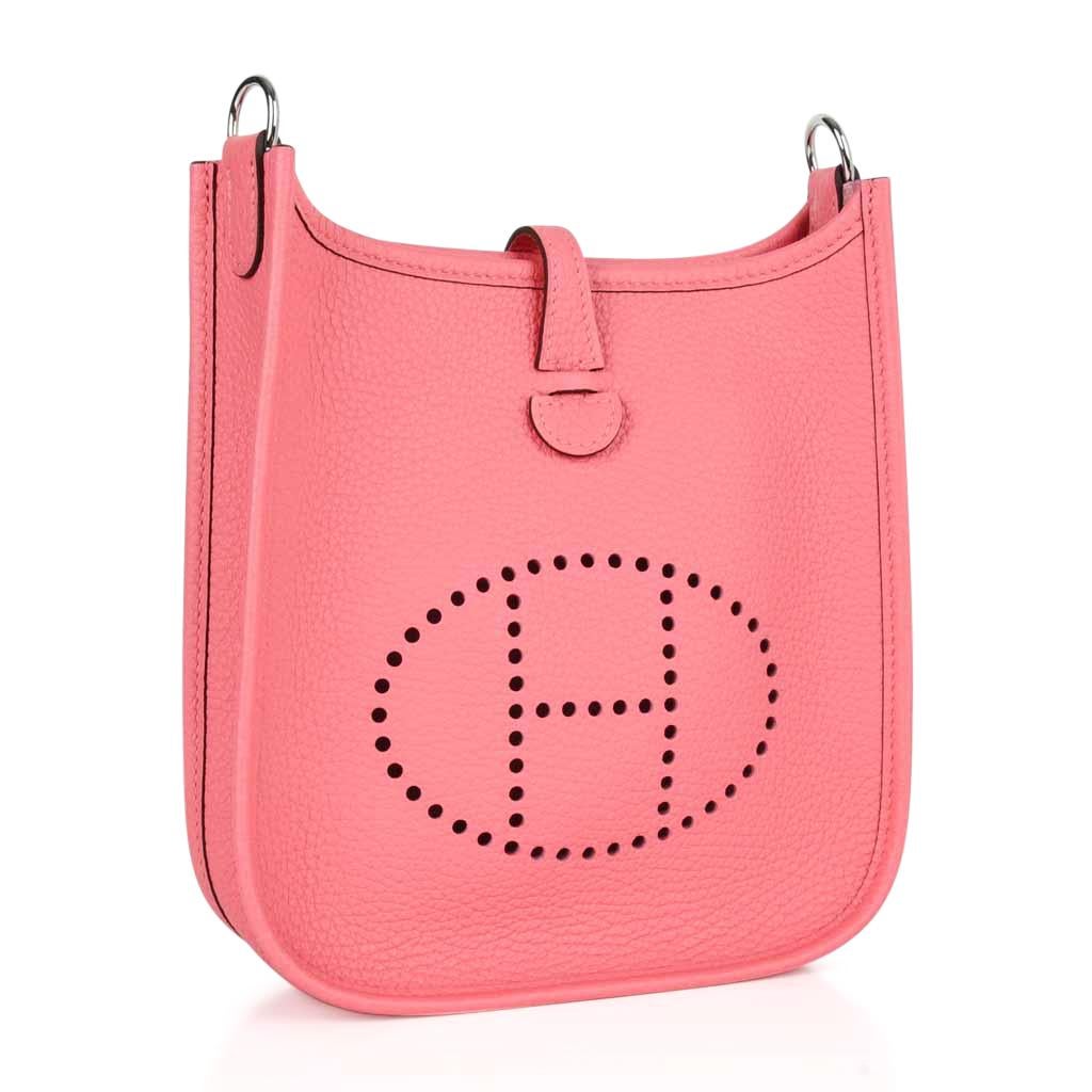 Guaranteed authentic Hermes Evelyne TPM Mini in coveted Rose Azalee pink.  
Clemence leather is soft and scratch resistant.
Signature perforated H on front of bag.
Fresh with Palladium hardware.
Fabulous shoulder or cross body bag. 
Sport strap in