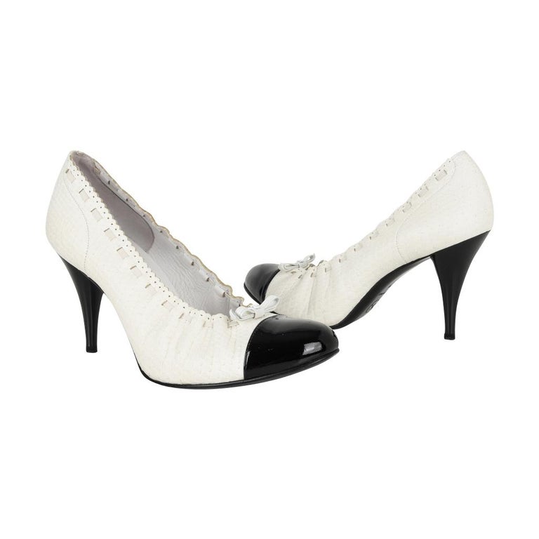 white snakeskin pumps