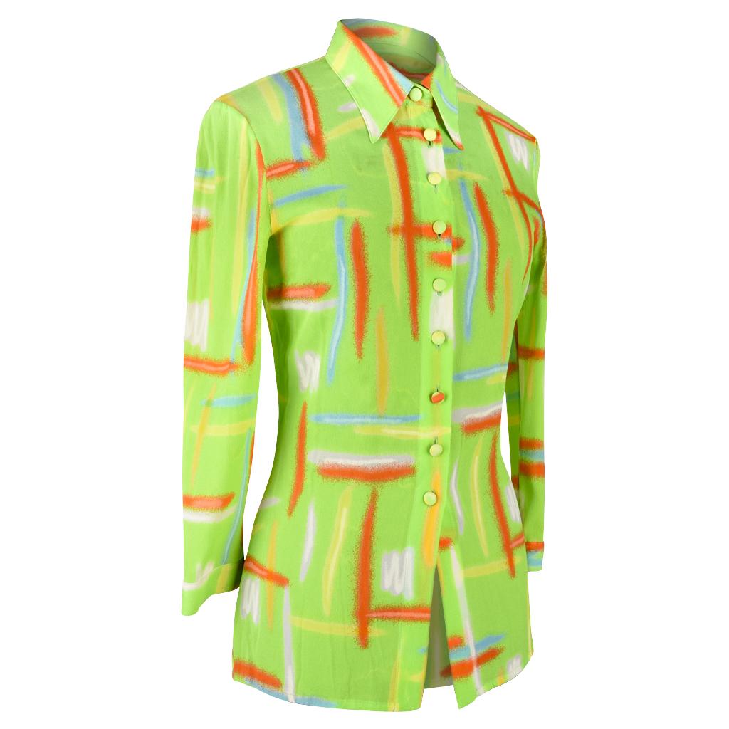 Guaranteed authentic Gianni Versace Couture Vintage top with 3/4 sleeve created when Gianni ran the House of Versace. 
Vivid lime green with shades of orange, buttery yellows, soft mauve, winter white and touches of blue.
The print has the effect of