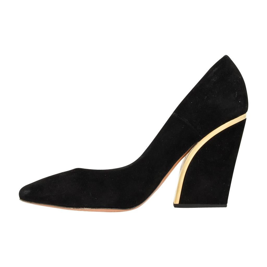 black shoes with gold detail