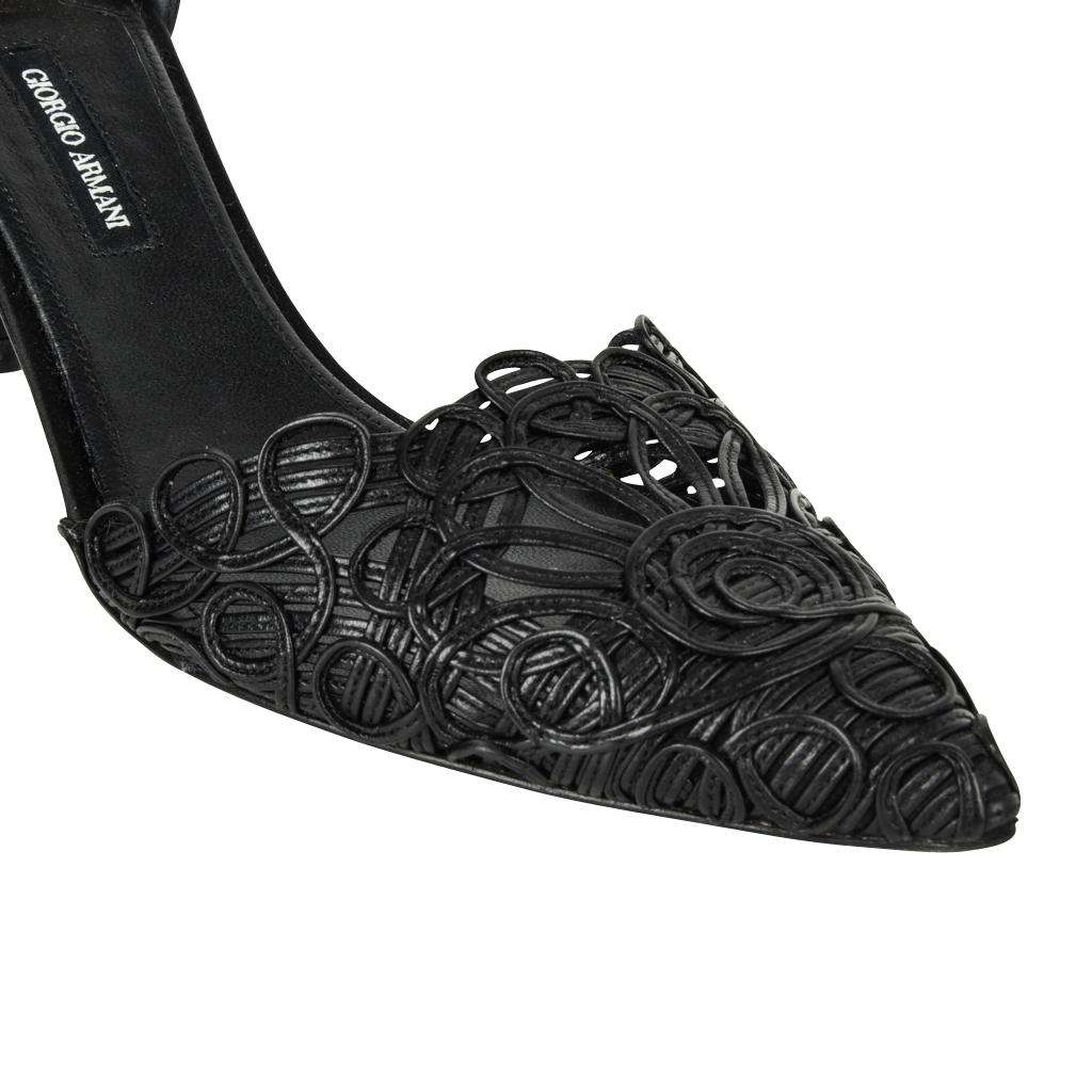 Guaranteed authentic Giorgio Armani beautifully cut d'orsay shoe in jet black.
The toe is created by leather woven and swirled to create a lace effect.
The back of the foot is black satin.
Gently pointed toe which elongates the leg.
The heel is