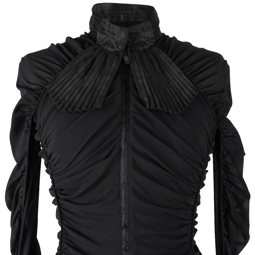 Guaranteed authentic Zac Posen fabulous zip front top.
Long sleeve mandarin collar.
Collar and french cuffs are accordion pleated taffeta with pleated fabric attached to collar that sort of looks like wide ties.
Cuffs have 3 working black ball cuff