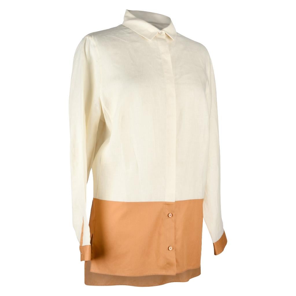 Guaranteed authentic Akris linen tunic shirt top.  
Color block features bone and butterscotch.
Side vents.
Shirt collar with hidden placket.
Beautiful warm neutrals.                 
 
SIZE  8

TOP MEASURES:
LENGTH  29.5