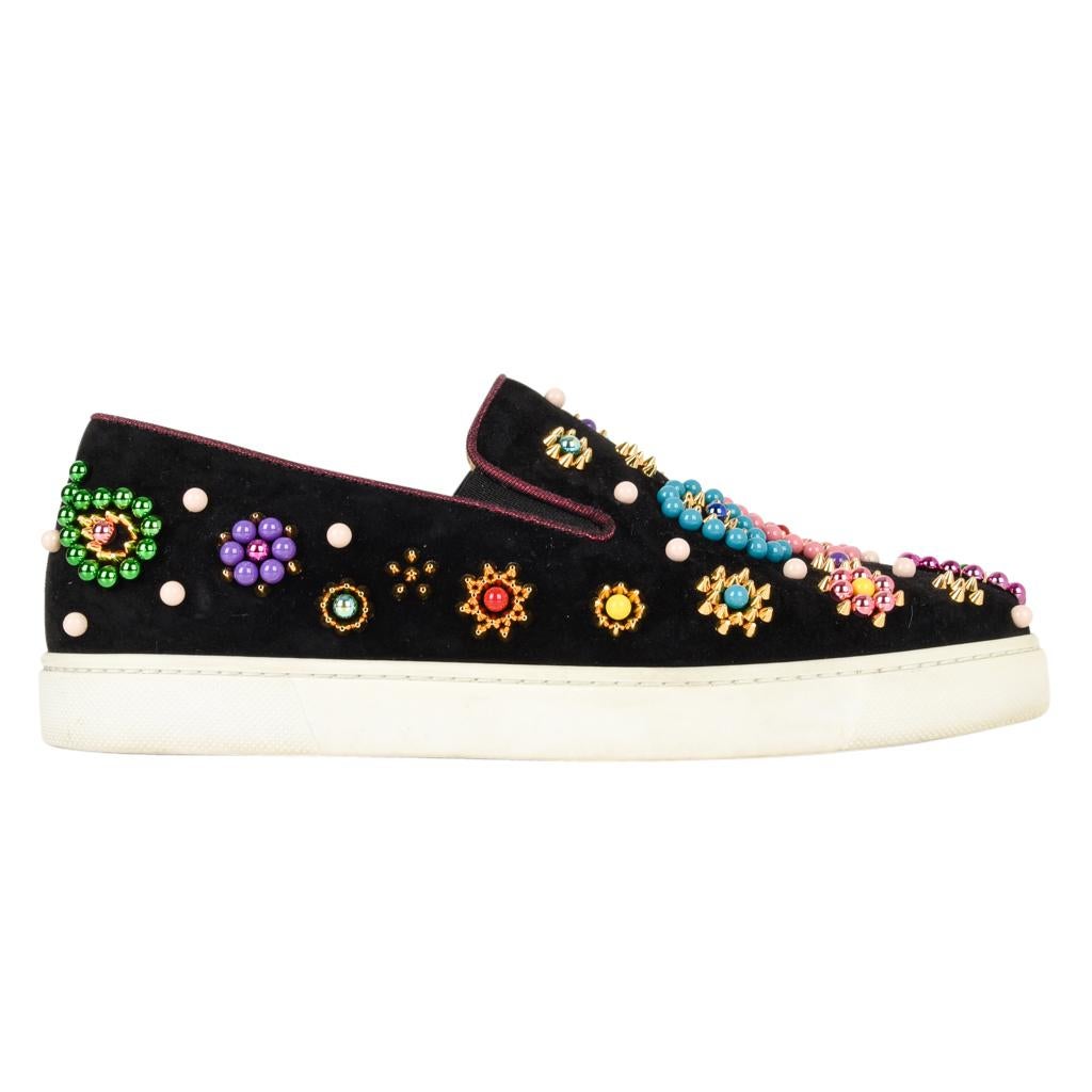 Guaranteed authentic Christian Louboutin Boat Candy slip-on sneaker. 
Black suede embellished with colored beads and gold toned studs.
Shoe has minimal wear on sole and sides - the suede is like new.


SIZE  39
USA SIZE 9 


SHOE MEASURES:
HEEL 