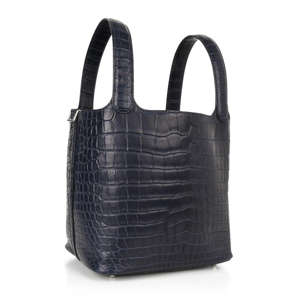 Guaranteed authentic Hermes Picotin Lock 22bag featured in Bleu Blue Indigo matte Porosus Crocodile.
This rare beauty is a collectors treasure!
An elegant neutral for the perfect tote.
Fresh with palladium hardware.
Comes with lock and keys,