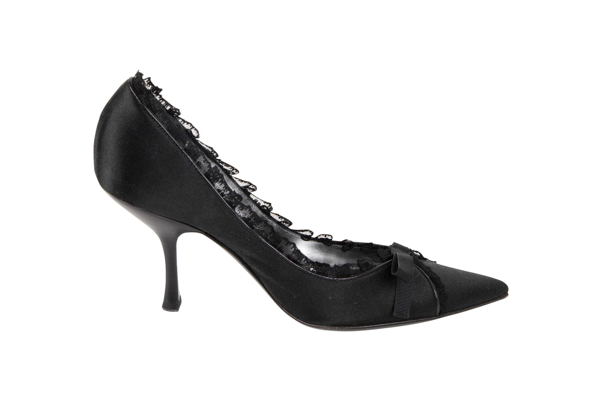 Guaranteed authentic Giorgio Armani lovely jet black satin pump.  
Edged in a small black lace 'ruffle' edged by a thin black leather that accentuates the pretty lace detail. 
Fabulous low cut in the front of the foot.
Small black peaux de soie bow.
