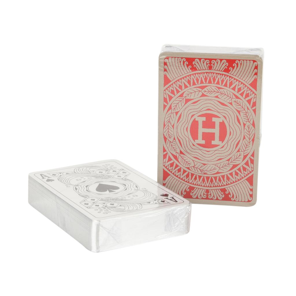 Guaranteed authentic Hermes playing cards features Les 4 Mondes bridge set. 
Marvelous gifting idea!
1 set is red and gray the other is black and gray. 
Trim color is silver.
The cards are new and sealed. 
Comes with signature Hermes box and