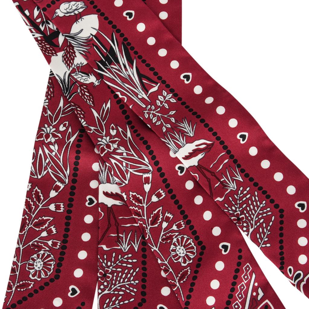 Guaranteed authentic Hermes Twilly silk scarf set of 2 Entre Ciel Et Mer Bandana print.
Charming and whimsical, this print is designed by Christine Henry.
Versatile in Rouge, Blanc and Noir. 
Comes with signature Hermes box and ribbon.
NEW or NEVER