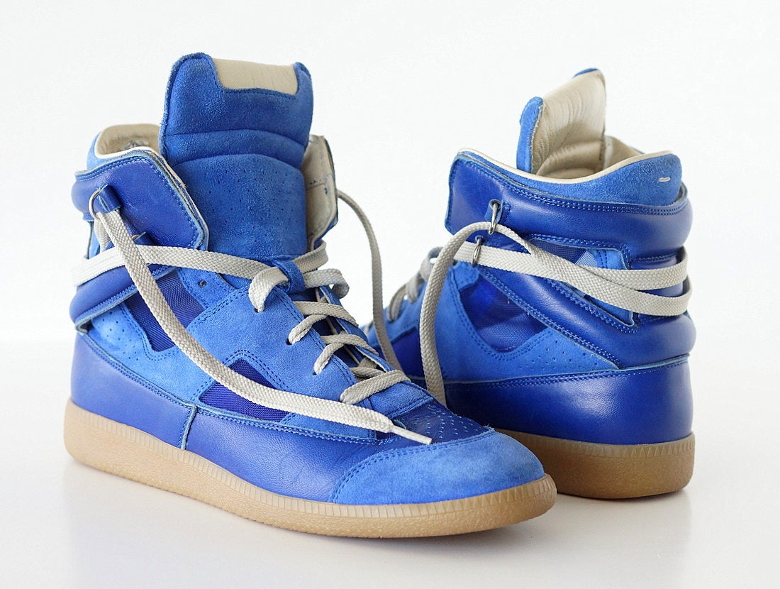Guaranteed authentic MAISON MARTIN MARGIELA  coveted blue high top sneaker.  Sold  out.
Vivid blue suede, leather and mesh.
Gray laces.

SIZE 39
USA SIZE 9

INSOLE  10