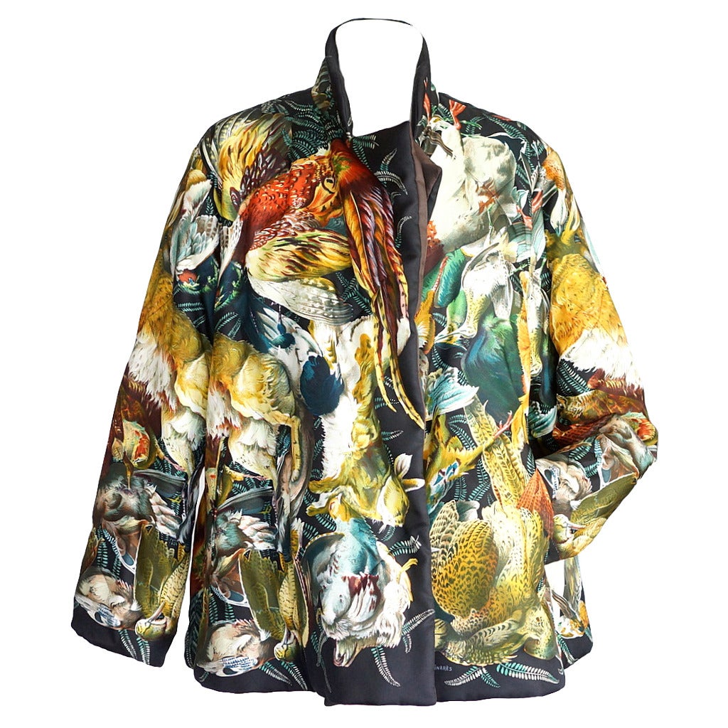 Guaranteed authentic Hermes Lightyly wadded silk jacket feaures magnificent Gibiers print designed by  by Henri de Linares.
Created in 1966, this rare and distinctive palette is a coveted collectors piece.
Depicts a bounty of birds and