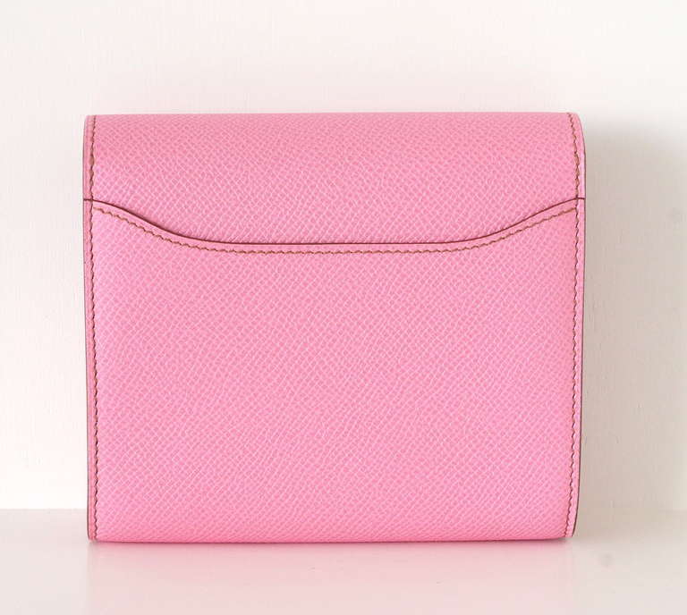 Extraordinarily beautiful and rare Hermes Constance wallet in 5P Pink Epsom
Palladium hardware.
Lined in glove leather.
4 Credit card slots.
1 Zipper pocket and 2 open slots.
1 exterior rear slot.
Logo embossed on buckle and interior zipper