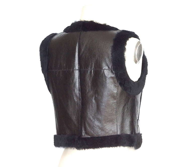 Guaranteed authentic Chanel  05A  fabulous jet black patent leather vest. 
Fully fur lined and edged in the softest black rabbit fur.
Two front slot pockets.  
Logo embossed plaque in front.
final sale 

SIZE 38
USA SIZE 4

TOP MEASURES: 
LENGTH 