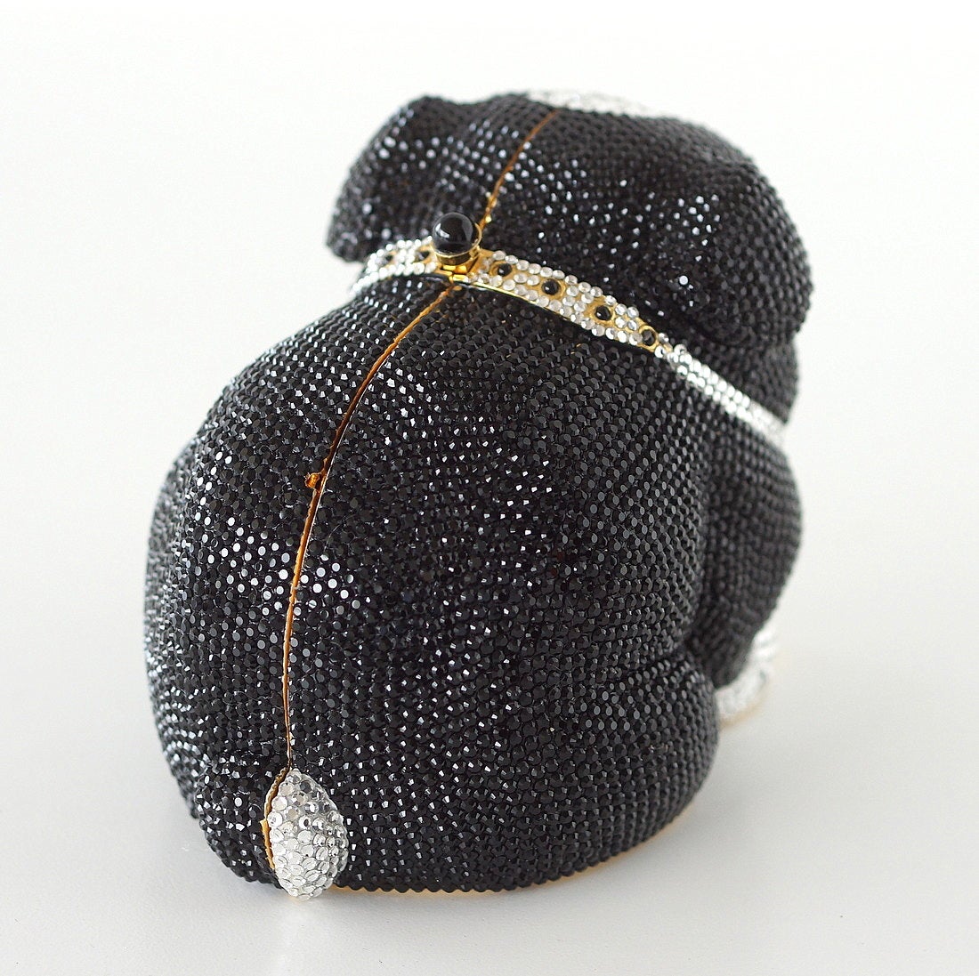 Rare charming Bulldog in black and white signature Swarovski Austrian crystals.
Rear of jeweled collar has push lock closure.
The entire shaping and facial expression will make you fall in love with this treasure.
Interior is lined in gold