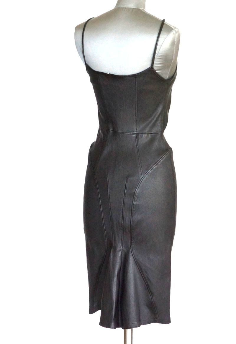Guaranteed authentic GIVENCHY exquisitely shaped black stretch lambskin dress. 
Bold front zipper with double toggles.
Stitch and leather detail at waist area accentuates your fabulous curves.
Fabulous fishtail at rear.
Dress is unlined.
more