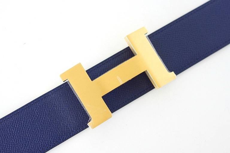 HERMES coveted reversible belt in Blue Sapphire Epsom leather and Bleu Izmir box leather. 
Fabulous over sized brushed gold Signature H buckle.   
Signature HERMES PARIS MADE IN FRANCE is stamped on the belt. 
BRAND NEW.  NEVER WORN. 
Comes with