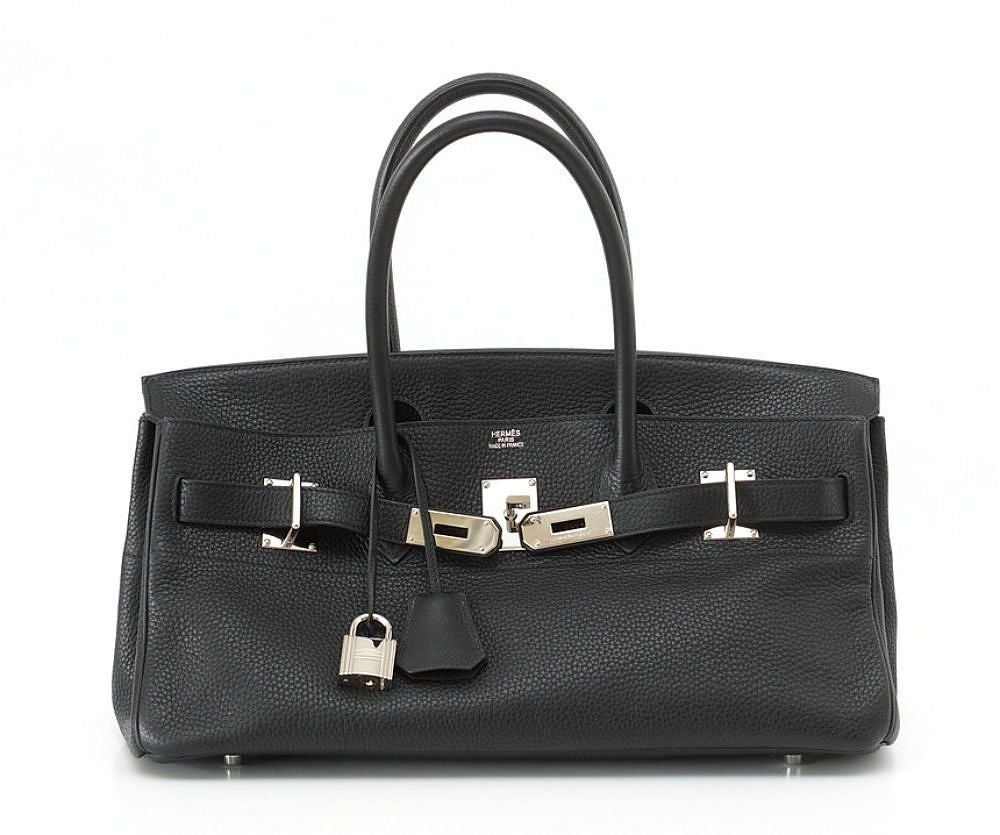 The ORIGINAL JPG Shoulder Birkin.
Jet black clemence leather.
Accentuated with the Palladium hardware.
A terrific play on the hardware and shape makes this bag a standout beauty!
SO difficult to find - this is a collectors dream!
Bag is clean inside