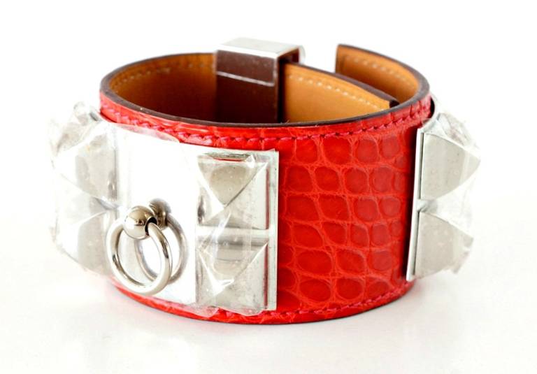 The chic and instantly recognizable HERMES CDC Collier de Chien cuff bracelet.  
Rouge H matte Alligator Palladium hardware.
Every fashionistas MUST HAVE. 
Bracelet is stamped inside.
Comes with signature brown pouch, orange Hermes box.
NEW or 