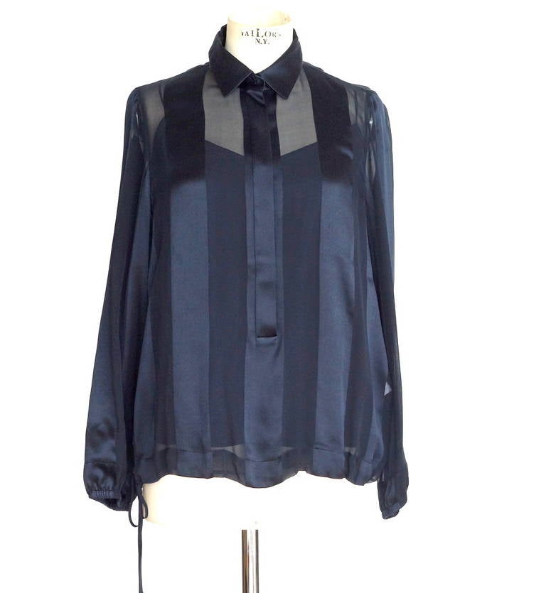 Guaranteed authentic AKRIS  beautiful 3 piece very dark navy set.  
Chic and elegant set in navy.
The silk fabric for the top and cami has chiffon and charmeuse in alternate stripes - beautiful effect!
The top has a shirt collar and a hidden