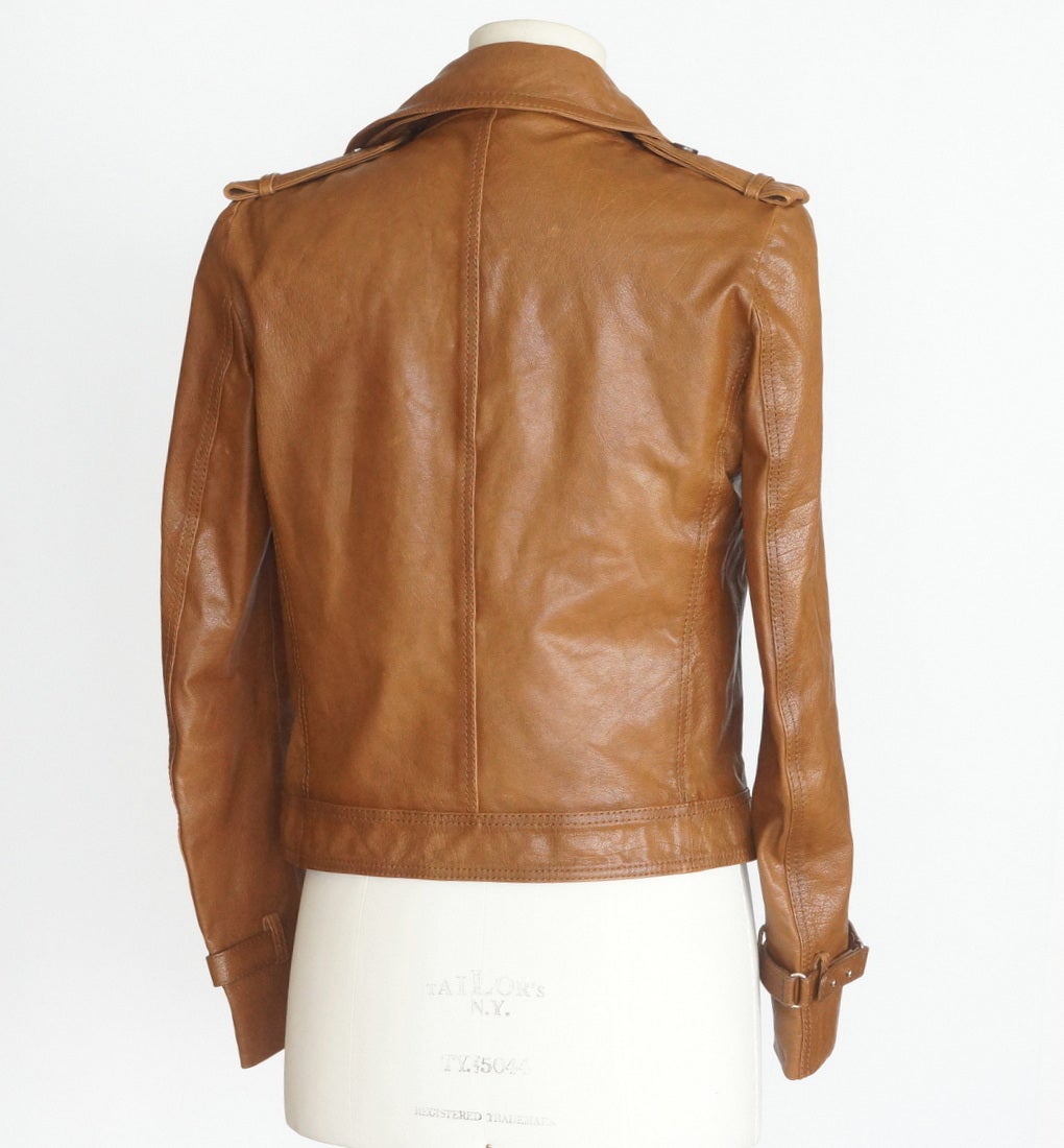 Guaranteed authentic GUCCI vintage lightly textured leather bomber jacket.  
5 Button aviator style jacket with top stitch detail. 
Shoulder flaps and epaulets. 
Please see detail underneath collar in pictures.
All buttons embossed GUCCI.
3