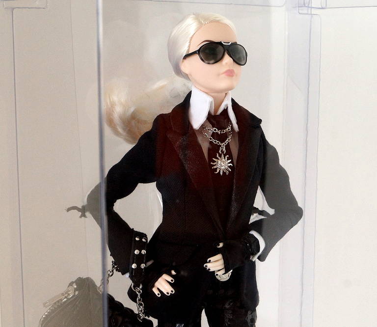 Insanely fabulous Limited Edition KARL LAGERFELD Barbie Doll.
Barbie sports the iconic Lagerfeld chic, right down to fingerless gloves and tie around jacket sleeve.
NEW.  Comes with Karl Lagerfeld gift box and papers.