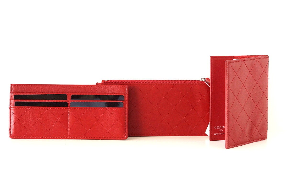 Fabulous red caviar travel wallet, clutch, passport holder, bill fold holder and change holder. 
Clutch has exterior rear slot pocket. 
Interior rear has 6 CC slots.
Change holder has zipper top and 2 CC slots.  Billfold holder has 2 long slot